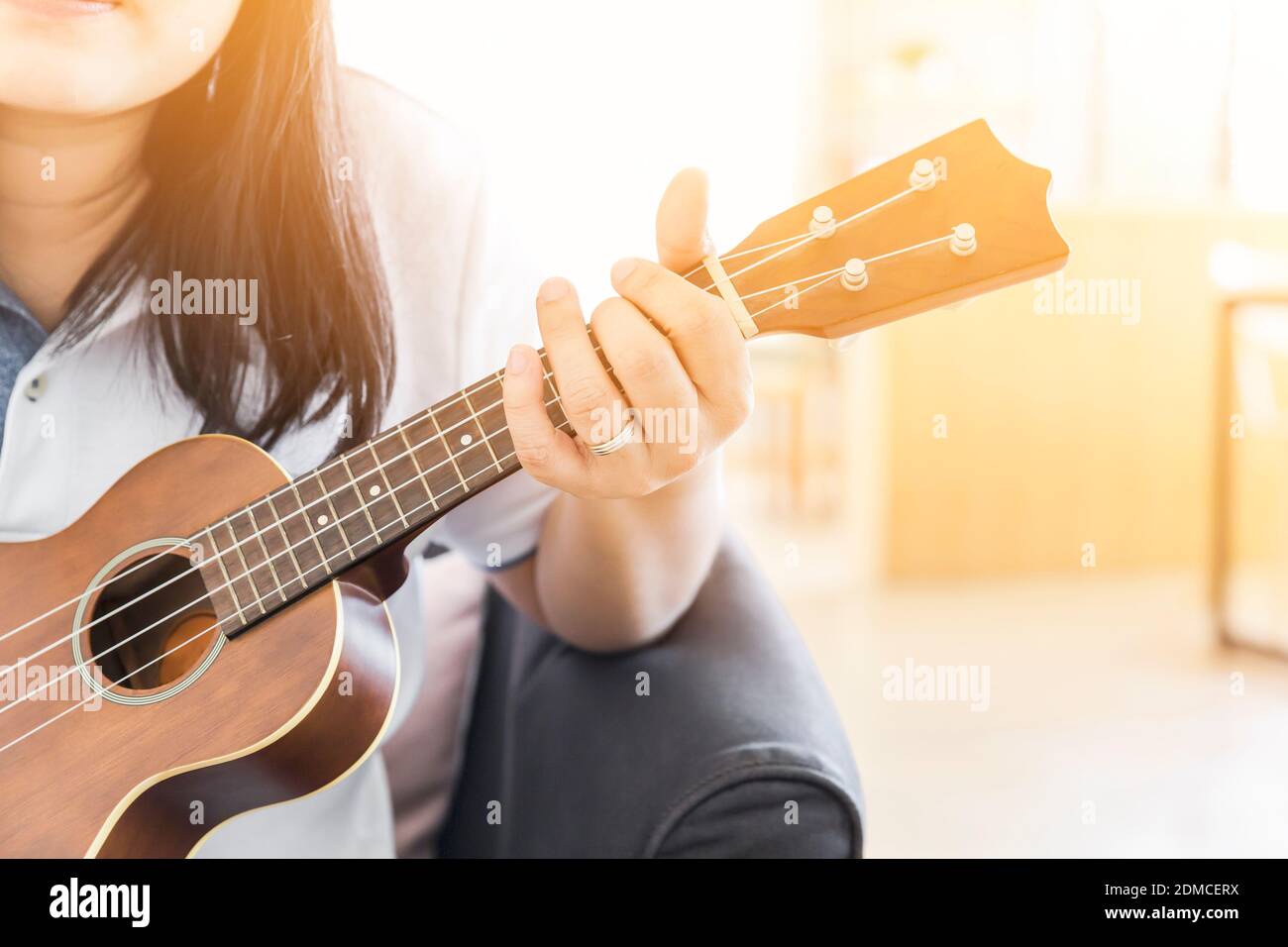 woman handicraft playing ukulele - selective focus, copy space for advising  - music concept Stock Photo - Alamy