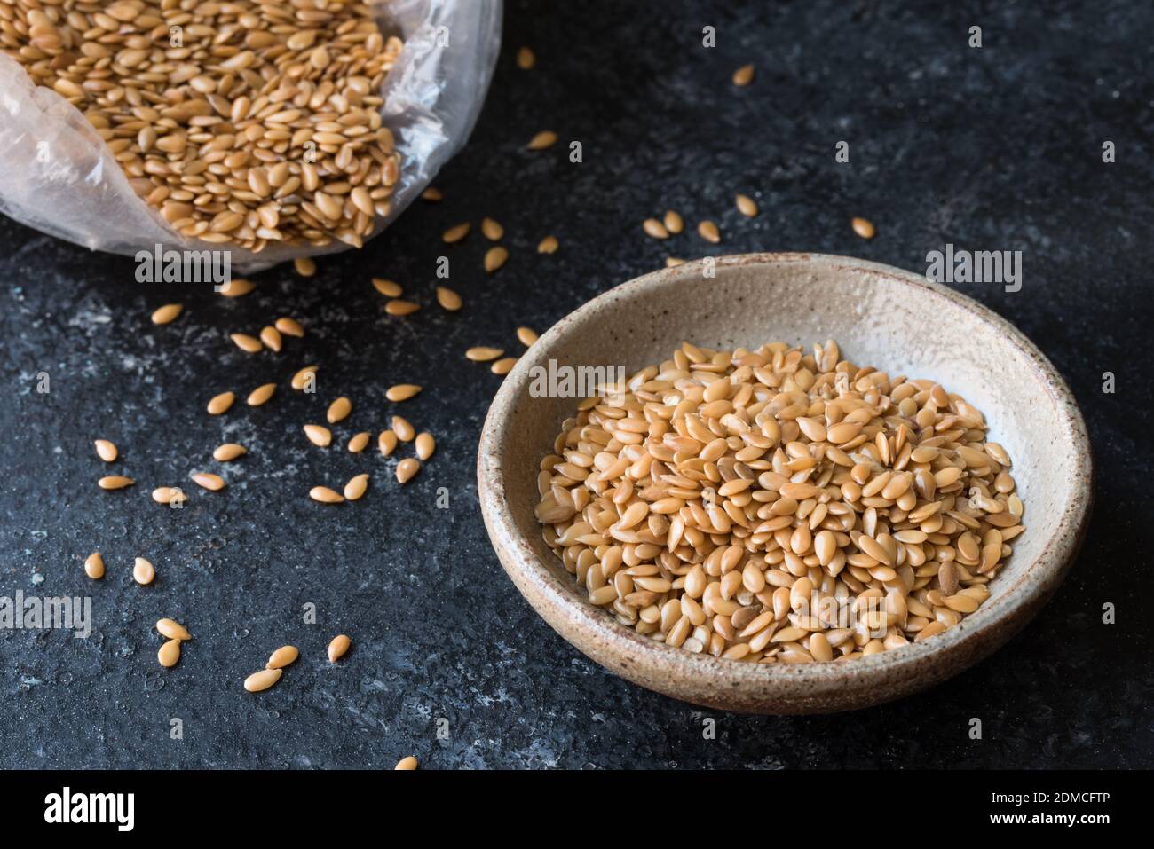 High Angle View Of Flax Seeds In Bowl On Table Stock Photo