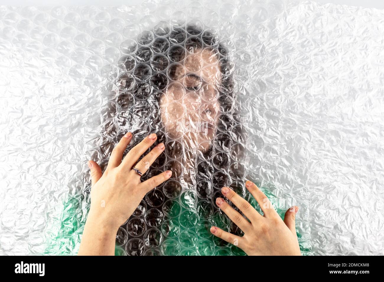 Closeup Of Woman Hand Holding Bubble Wrap Over Face Stock Photo Alamy