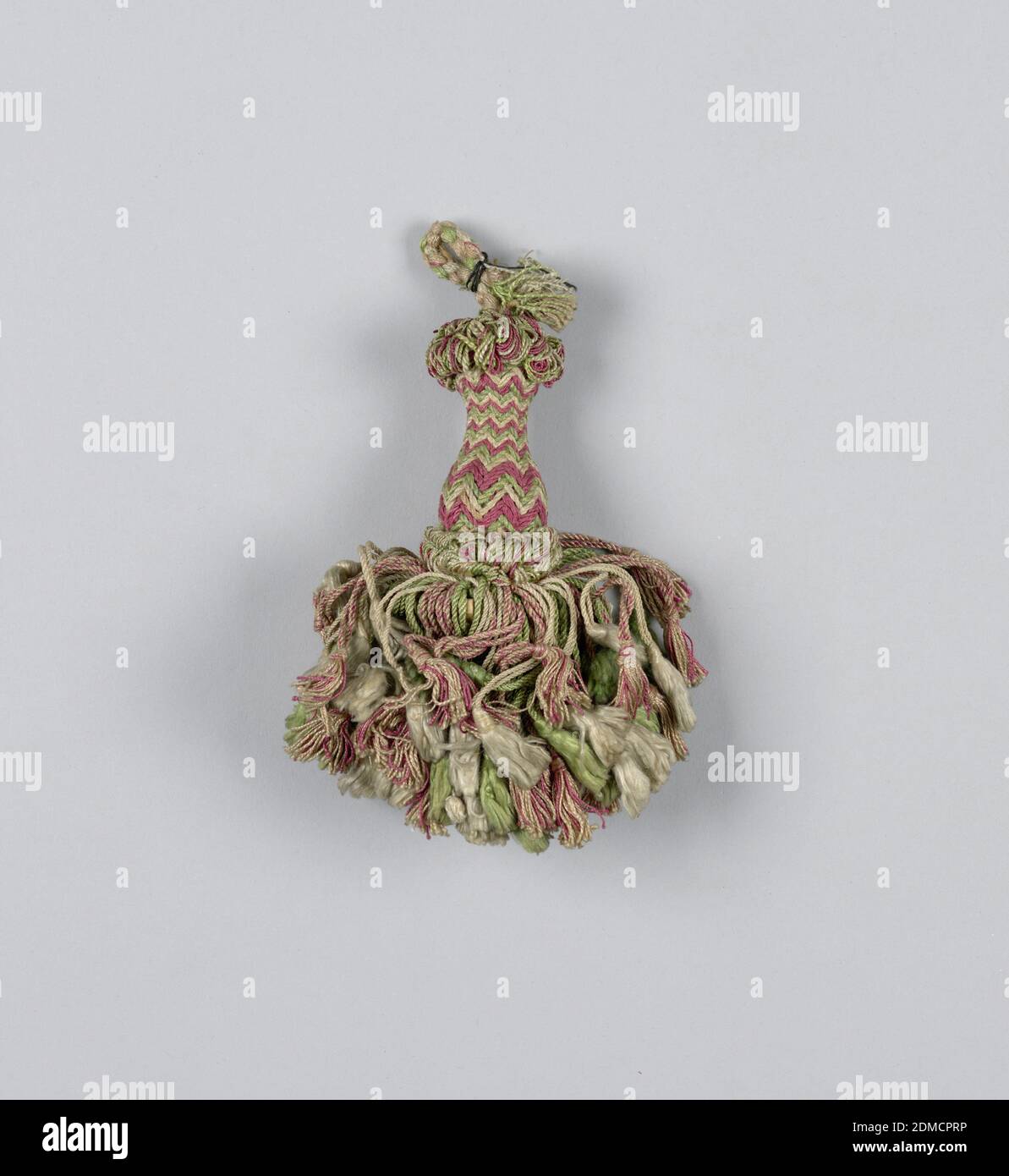 Tassel, Medium: silk, wooden core, Skirt of pink, white and green silk threads, twisted and looped, and each supporting a tassel of its own color. Head is vase-shaped and wrapped in pink, white and green threads in a chevron pattern. Collars are formed by looped threads at the top and bottom. Cord of braided silk threads., Spain, 19th century, trimmings, Tassel Stock Photo