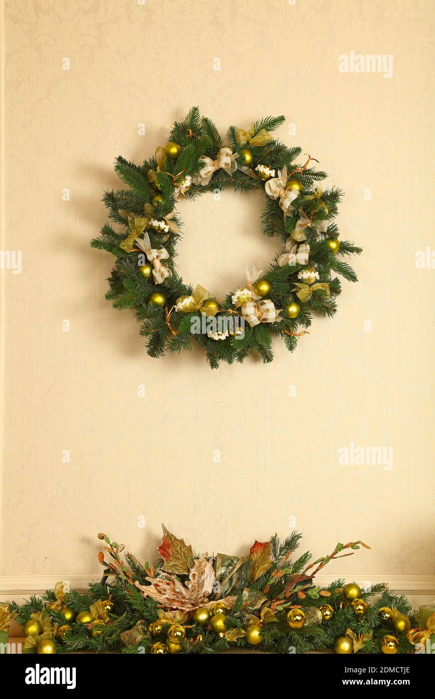 Wreath Hanging On Wall During Christmas Stock Photo