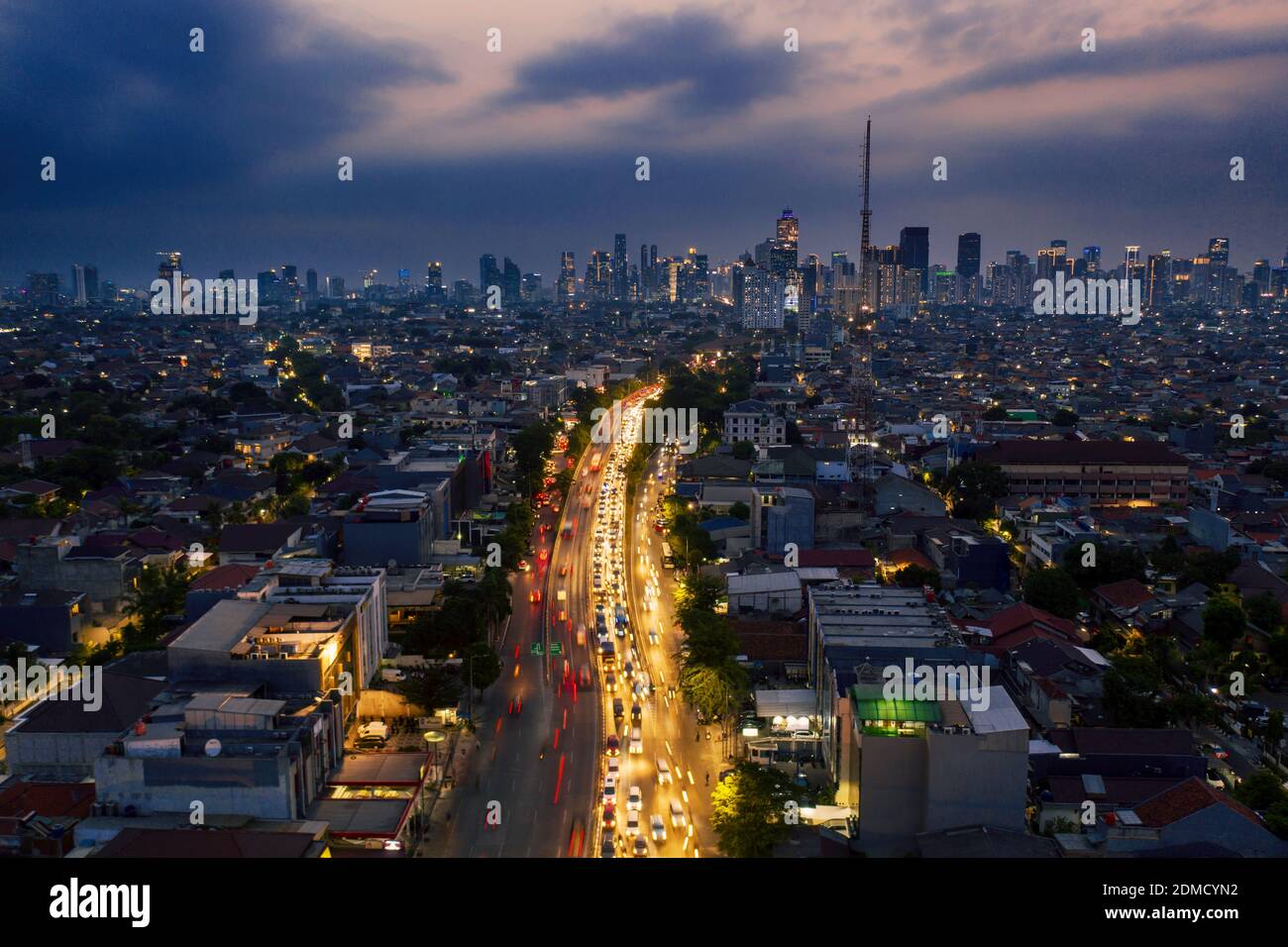 JAKARTA - Indonesia. November 12, 2019: Jakarta after office hour traffic  jam in Kampung Melayu with Jakarta skyline in background Stock Photo - Alamy