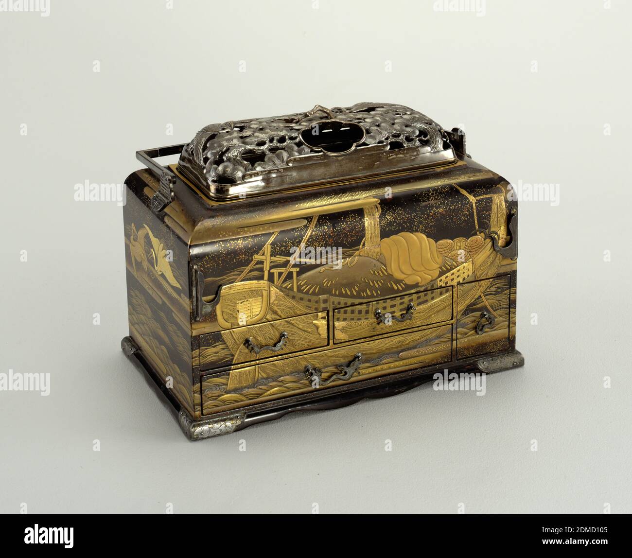 Smoking Stand (Tabako-Bon), wood, lacquer, gold, silver, brass, Rectangular black, gold and red lacquered box (a) with hinged, rectangular silver handle; rectangular domed cover (b) of pierced and molded silver, depicting two flying cranes among pine trees, small loop handle in form of branch at top; deep, rectangular brass tray under cover, set into top of box. Four drawers (d/g) in front of box; one drawer (h) in right side. Continuous lacquer decoration around box showing loaded boat floating on waves, floating dingy, cranes with red crests flying among clouds over water and pine branches Stock Photo