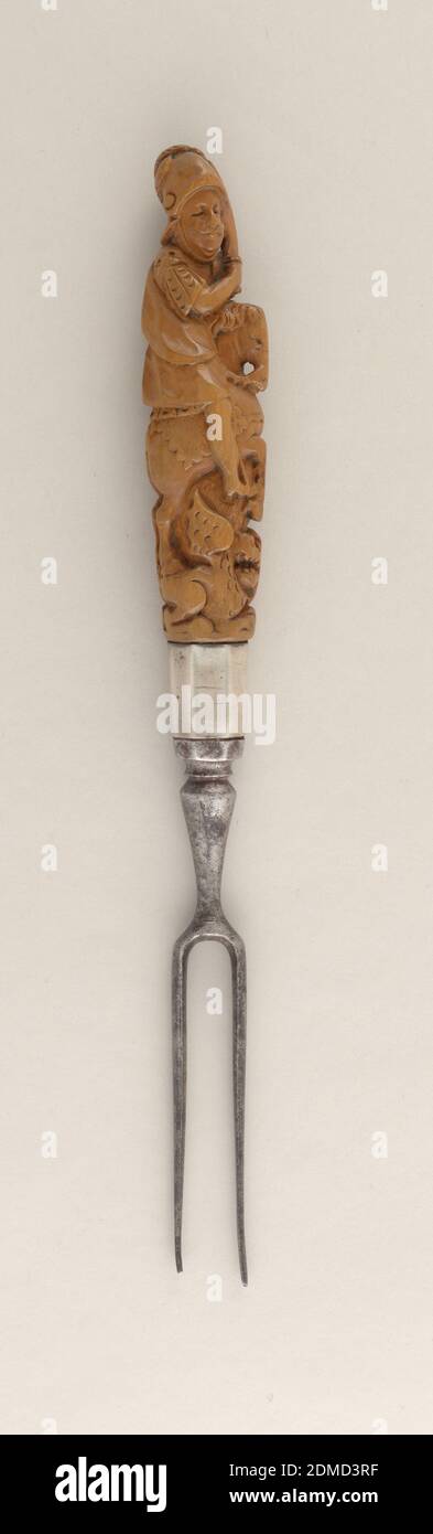 Fork, steel, brass, wood, Two-tined fork, baluster shaft. Octagonal plain brass socket. Carved wooden handle, three-dimensional figure of St. George on horse slaying the Dragon., England, ca. 1700, cutlery, Decorative Arts, Fork Stock Photo