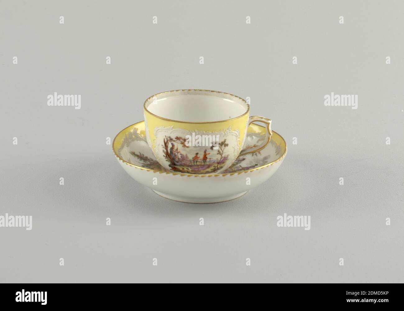 Cup and Saucer with Battle Scenes (Bataillen-Malerei), Royal Porcelain Manufactory, Berlin, German, established 1763, hard paste porcelain, vitreous enamel, gold, Curving cup. Slightly compressed in lower part. Scrolling handle. Saucer slightly curved. Decoration similar to that of 1953-17-49. Neuzierat style., Germany, 1870–1900, ceramics, Decorative Arts, cup and saucer, cup and saucer Stock Photo