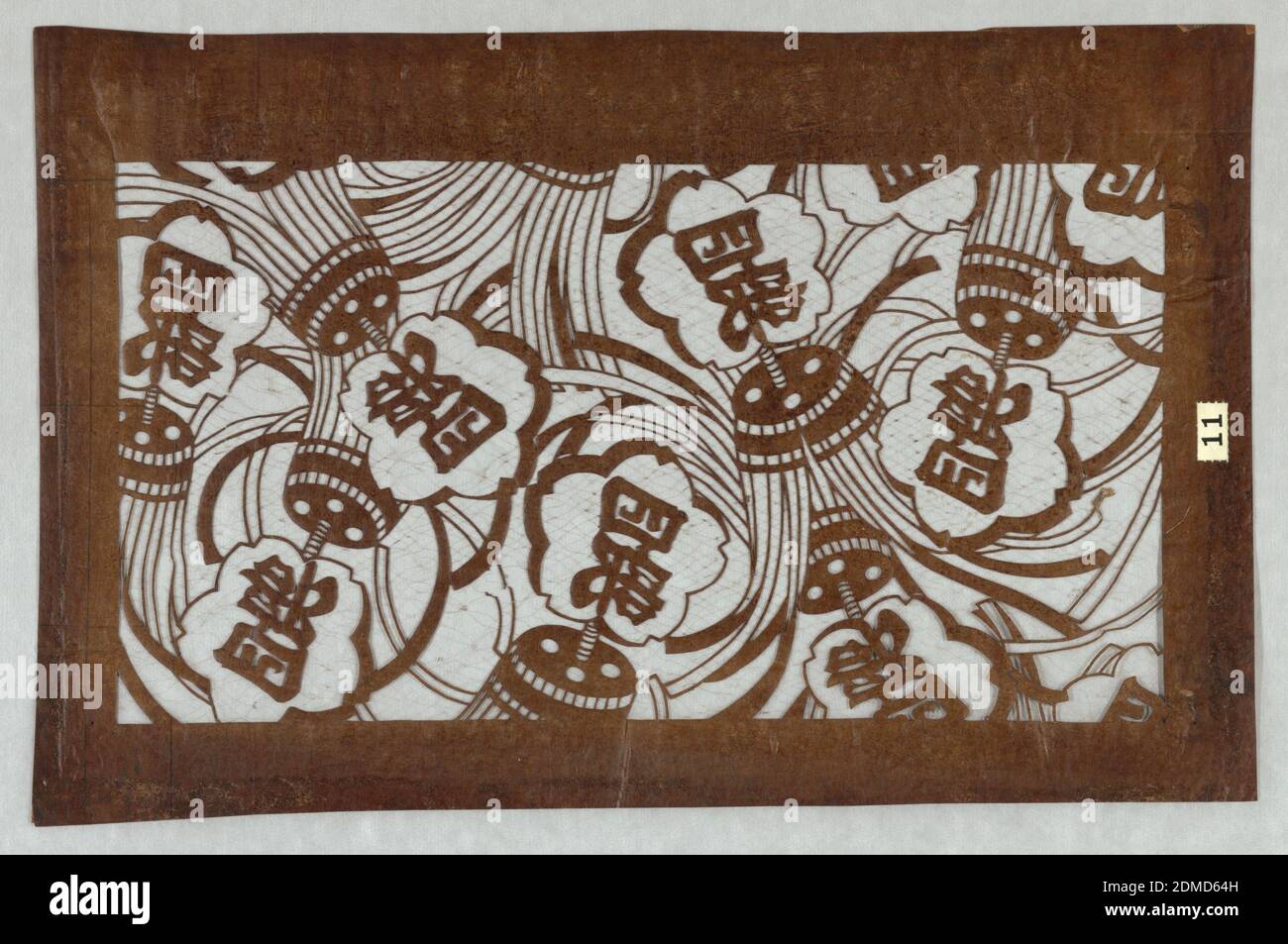 Matoi Motif, Mulberry paper (kozo washi) treated with fermented persimmon tannin (kakishibu), and silk threads (itoire), In Japan, firefighters would use a unit called a matoi to put out fires. Each firehouse would have a unique matoi. This stencil represents team four. Edo is also known as the city of fires since houses were built from timber and paper. There were five hundred major fires known between 1951 and 1867. Matoi is a popular motif in ukiyo-e prints from the nineteenth century., Japan, mid 18th - early 19th century, textile designs, Katagami, Katagami Stock Photo