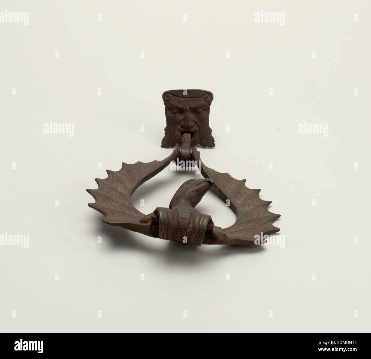 Door knocker, Bronze, Door knocker. Plate in the form of a grotesque