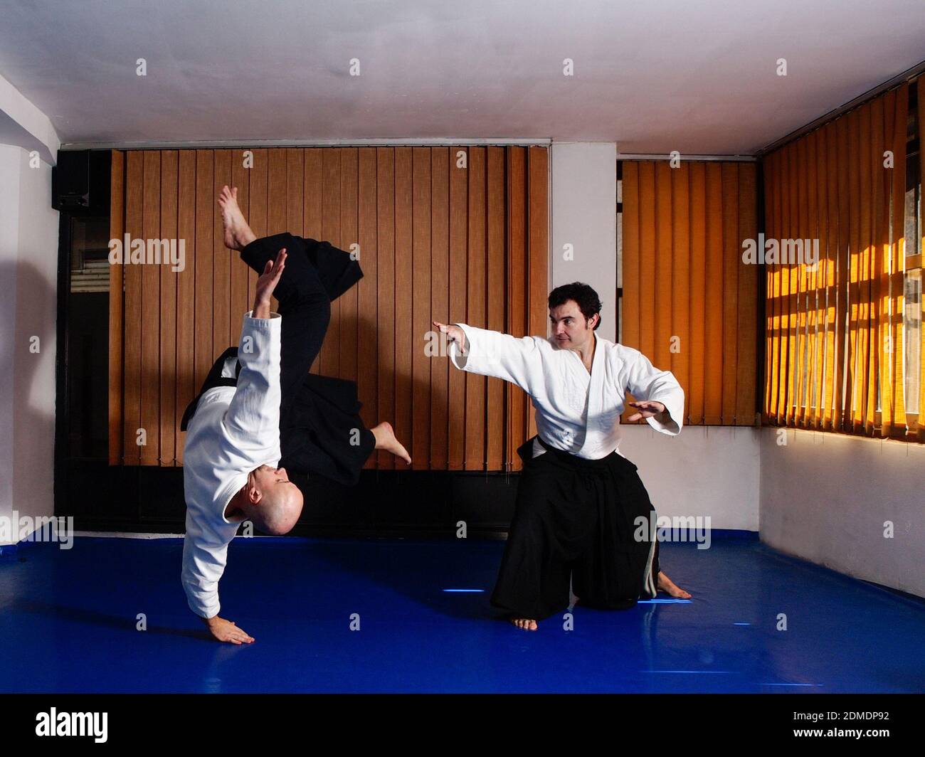 Martial art practitioner throwing away his partner Stock Photo Alamy