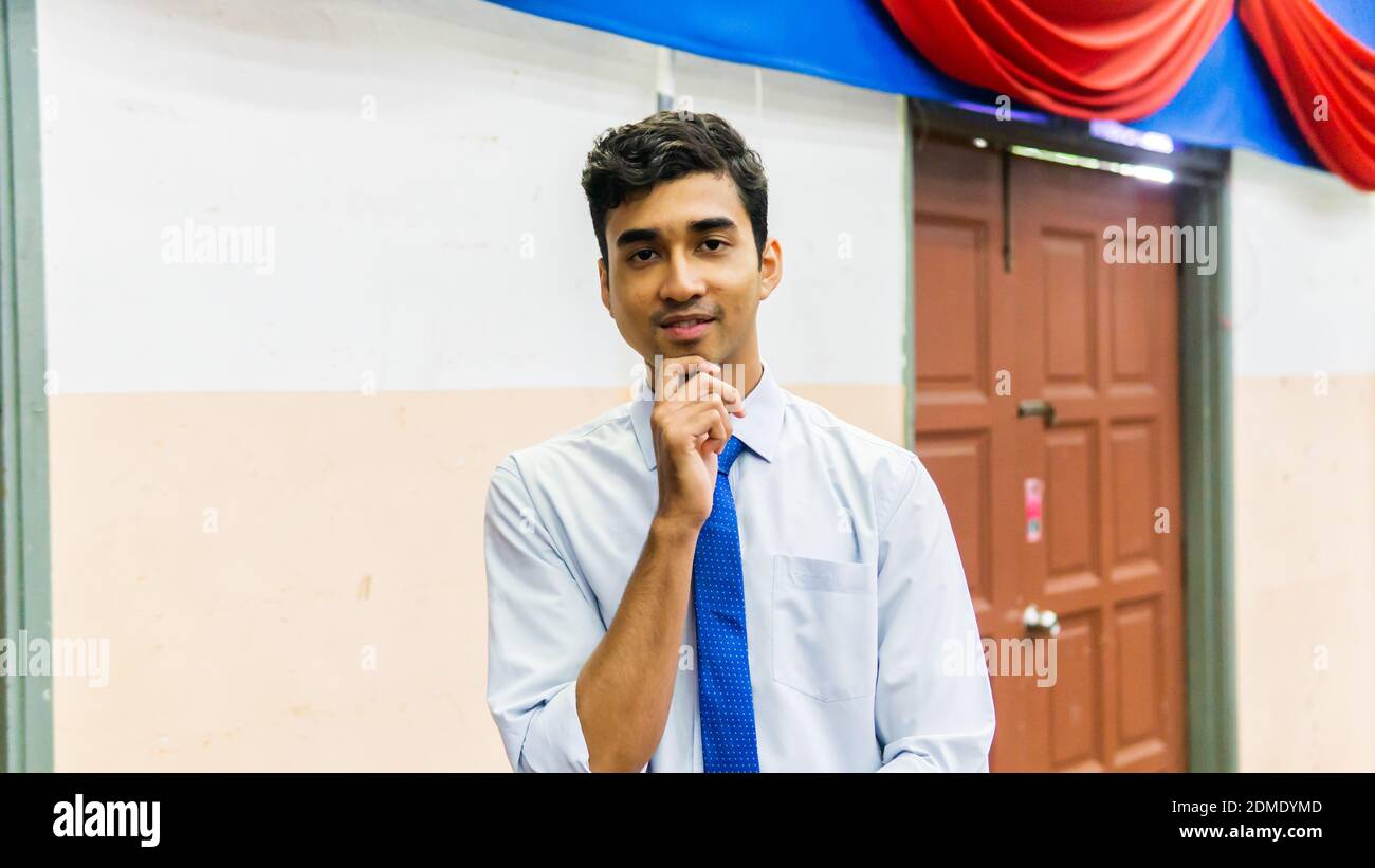 A portrait of a tall young Asian 