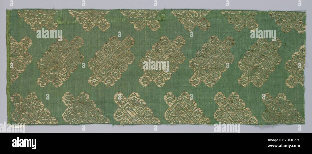 Fragment, Medium: silk, metallic Technique: plain weave with supplementary wefts, Diagonal arrangement of detached metallic ornaments in gold on green., 17th century, woven textiles, Fragment Stock Photo
