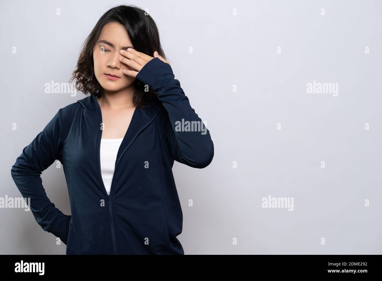 Woman has eyes pain isolated over white background Stock Photo Alamy