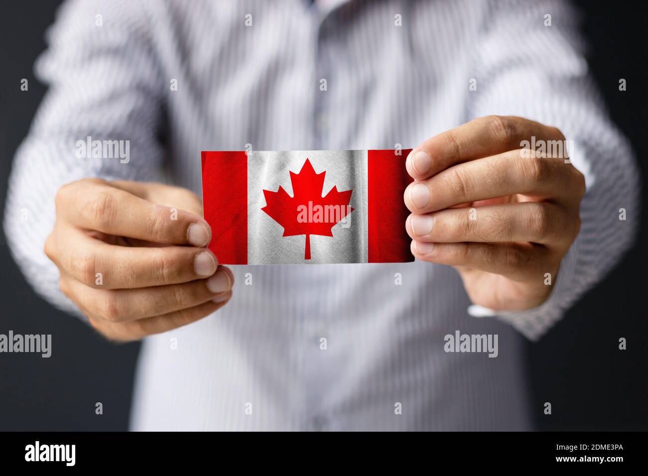 Holding canadian flag close up hi-res stock photography and images - Alamy