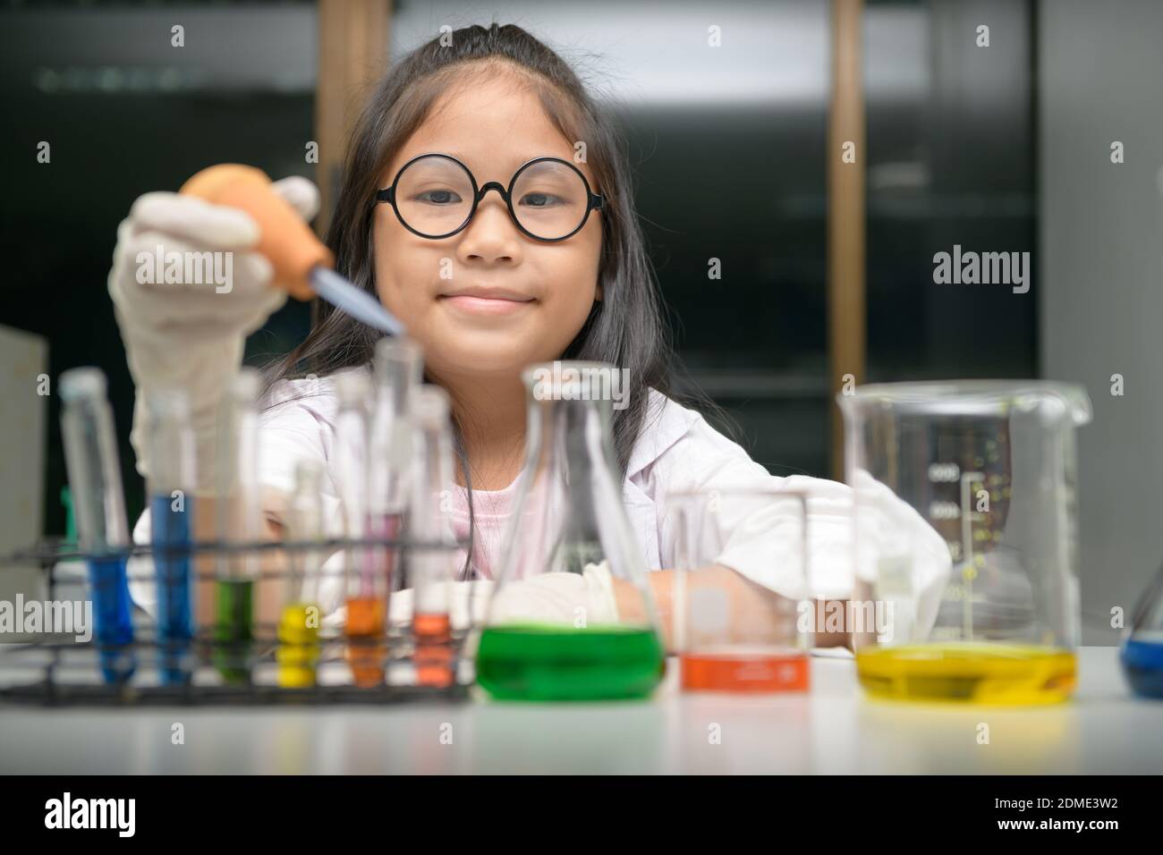 Little scientist use dropper to making experiment in chemical