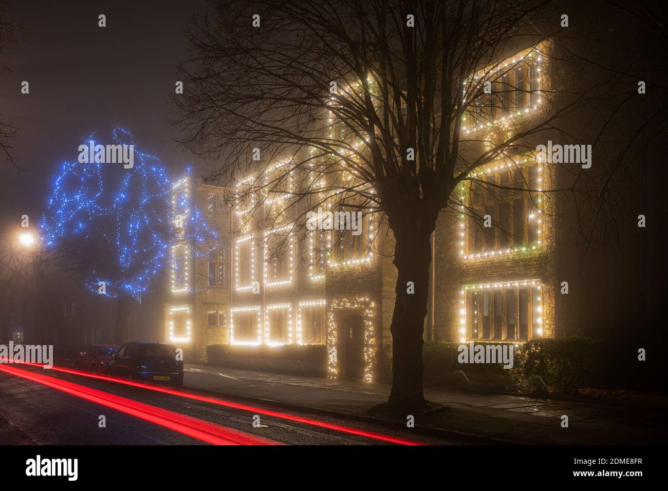 Winchester house school christmas lights in the late evening fog. Brackley, Northamptonshire, England Stock Photo