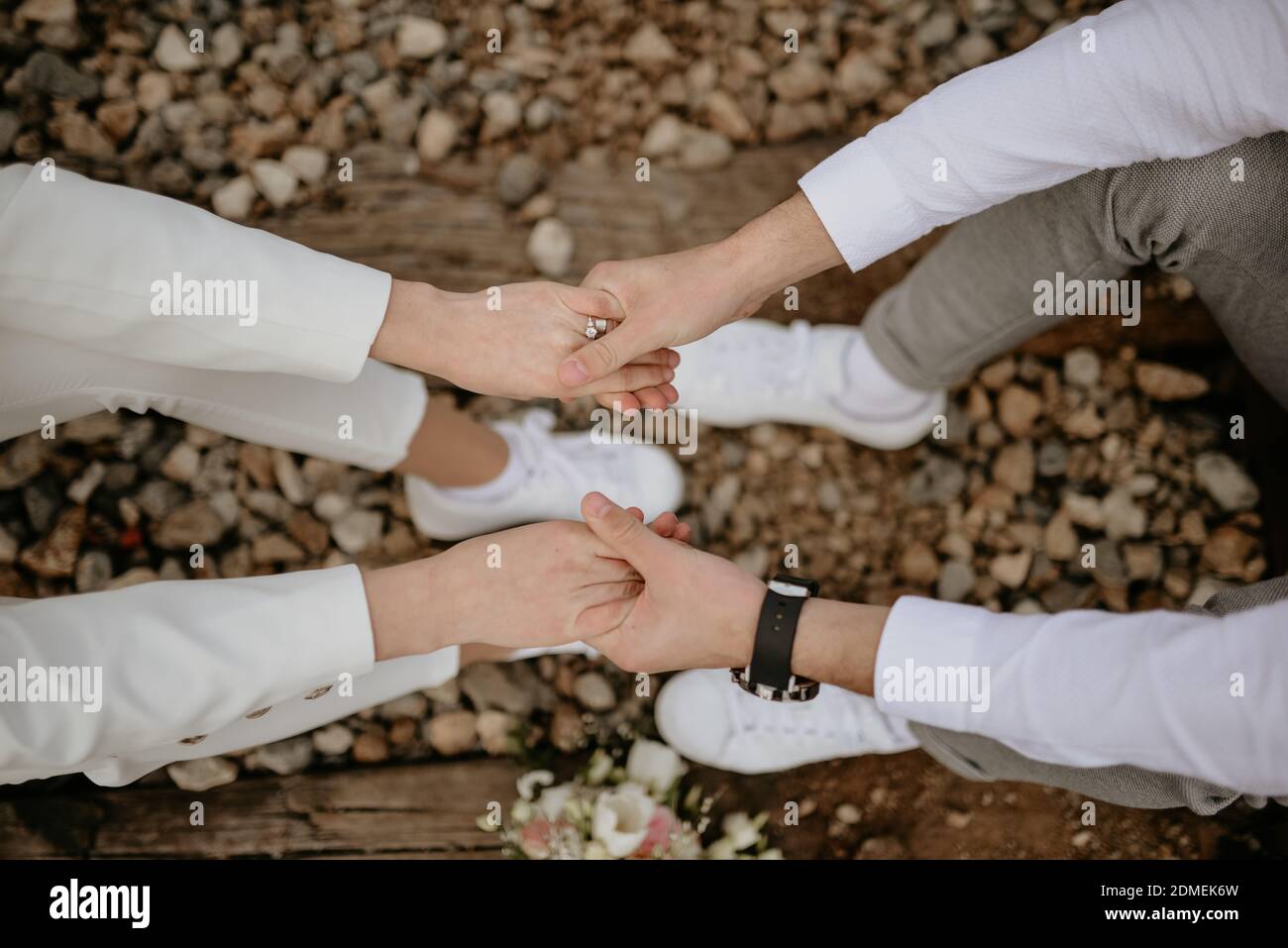 A top view of a couple holding hands in a park in autumn Stock Photo ...