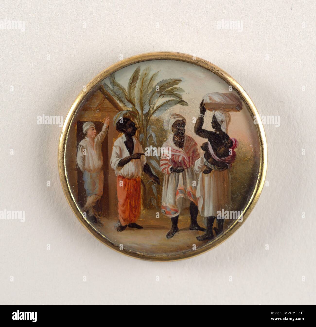 Button, Gouache paint on ivory verre fixé (affixed to) glass, ivory (backing), gilt metal, Button depicting scene with four figures in a landscape with palm trees. At left, a light-skinned man at entrance of a hut, as black-skinned man and woman, dressed in Western style working clothes, converse with another woman who wears only a skirt, carrying a child on her back and a package on her head., late 18th century, costume & accessories, Decorative Arts, Button Stock Photo