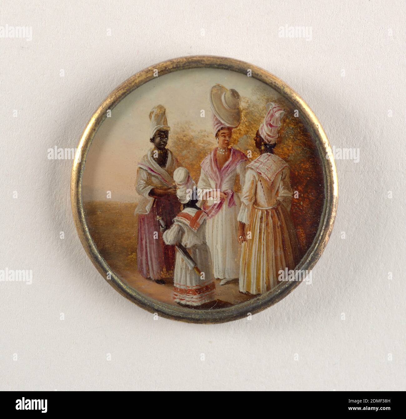Button, Gouache paint on tin verre fixé, ivory (backing), glass, gilt metal, Button depicting scene of four figures in a landscape. Three women and a child wearing dresses. At center a light-skinned woman in jewelry and large turban topped with a sunhat., late 18th century, costume & accessories, Decorative Arts, Button Stock Photo