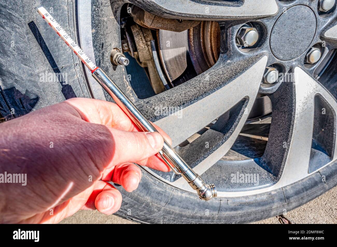 performing maintenance check on a vehicle tire by checking pressure