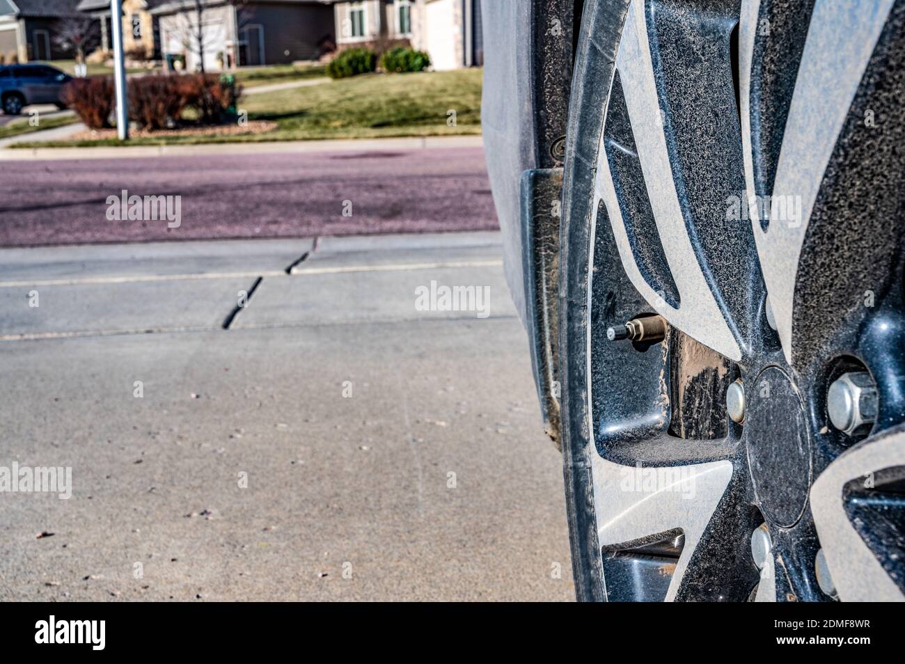 performing maintenance check on a vehicle tire by checking pressure