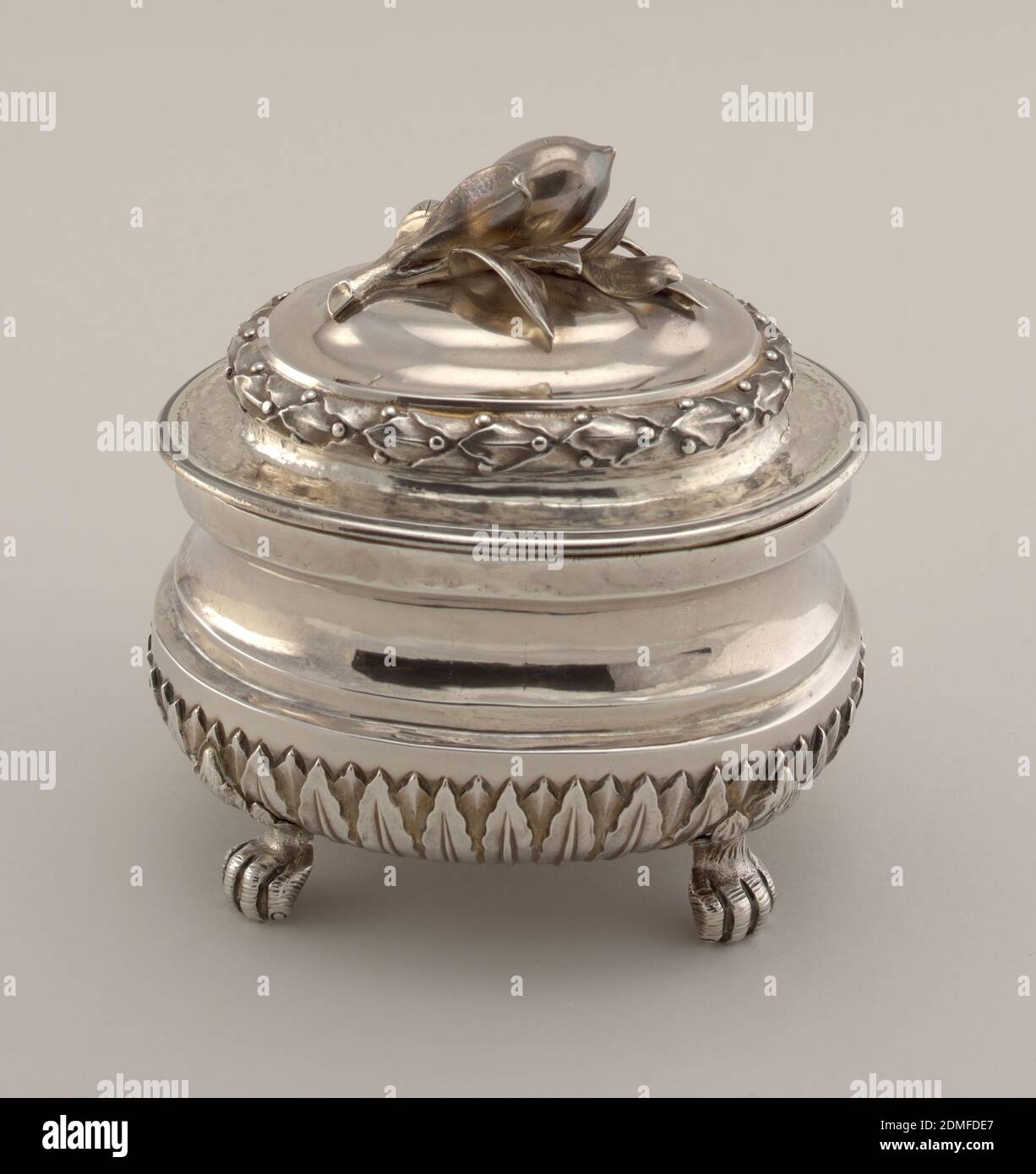 Sugar Bowl with Lemon Finial, silver, repousse, Bowl has lancet leaves on lower half, on four animal feet. Domed cover with repousse laurel wreath and lemon finial., Italy, ca. 1768, metalwork, Decorative Arts, sugar bowl, sugar bowl Stock Photo