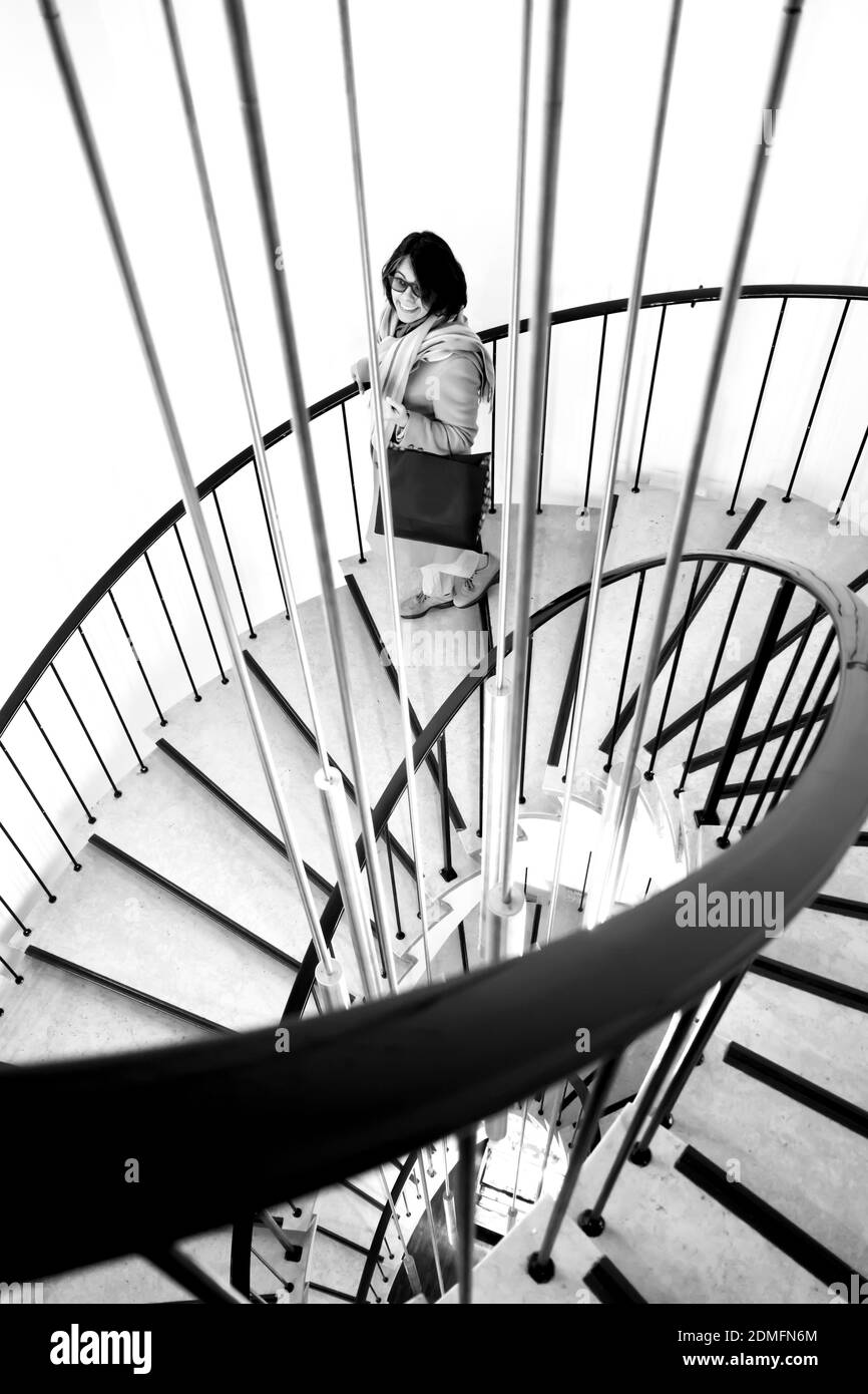 Woman Moving Down On Steps Stock Photo Alamy