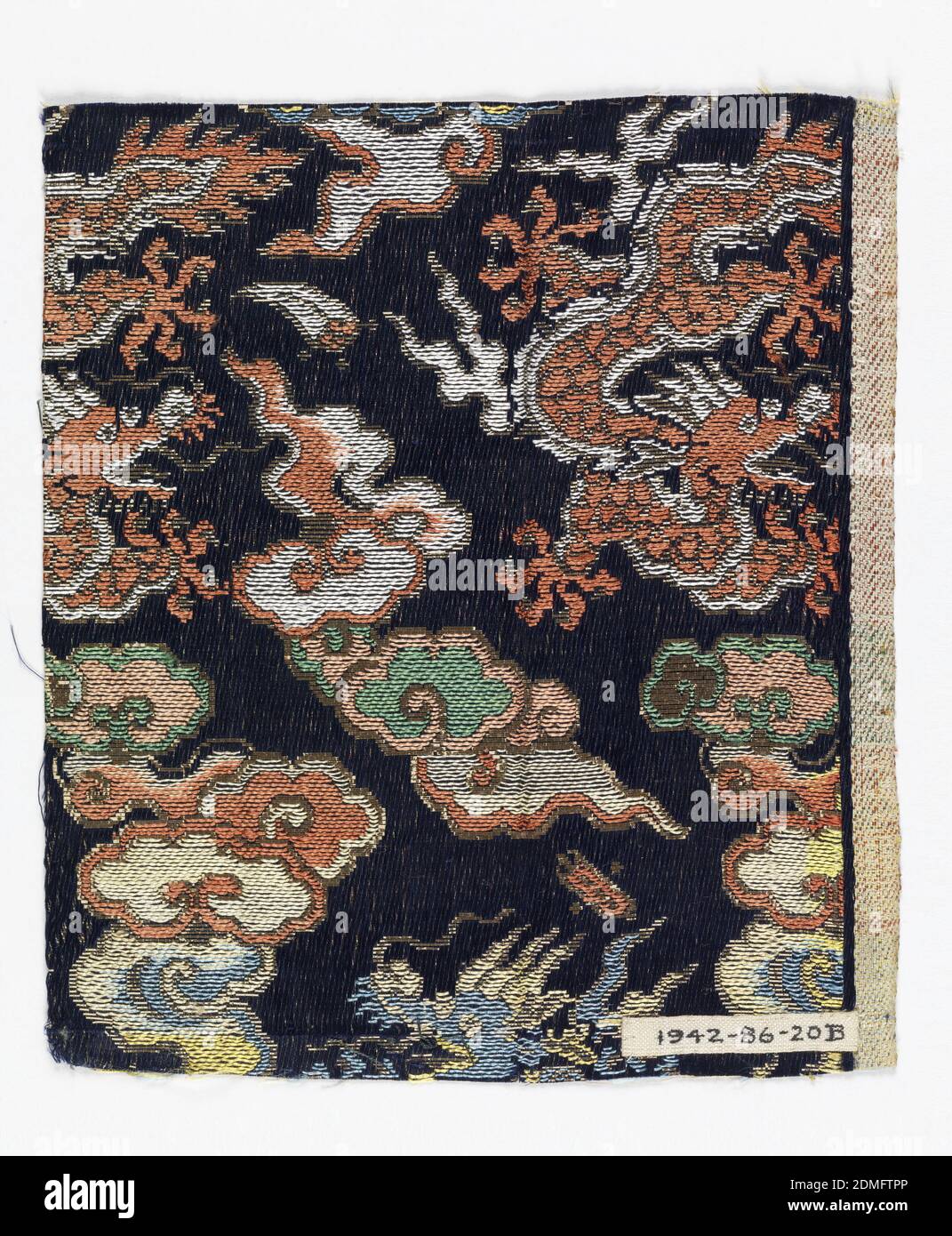 Textile fragments, Medium: silk, paper with applied gold foil Technique: plain compound twill, Navy blue twill ground with woven supplementary weft pattern of large scale dragons and flying clouds in rust, white, yellow, green, and sky blue silk threads with metallic paper threads., Japan, 19th century, woven textiles, Textile fragments Stock Photo