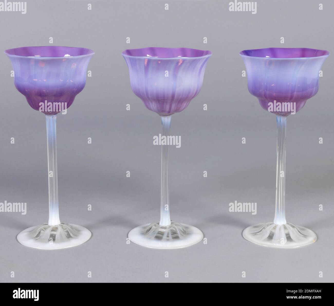 Wine Glass Tiffany Glass And Decorating Company American 1892 1900 Mouth Blown Favrile Glass Flower Shaped Cup With Pink And Mauve Interiors Shadowed On Exteriors With Milky White Fluted Clear Glass Stems With
