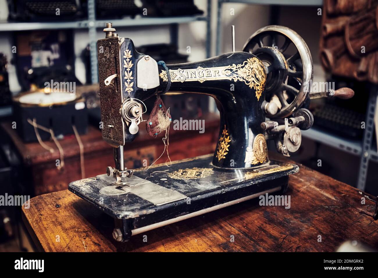 Ankara, Turkey - October, 2020: Vintage Singer sewing machine on the desk in an antique store in Ankara, Turkey. Stock Photo