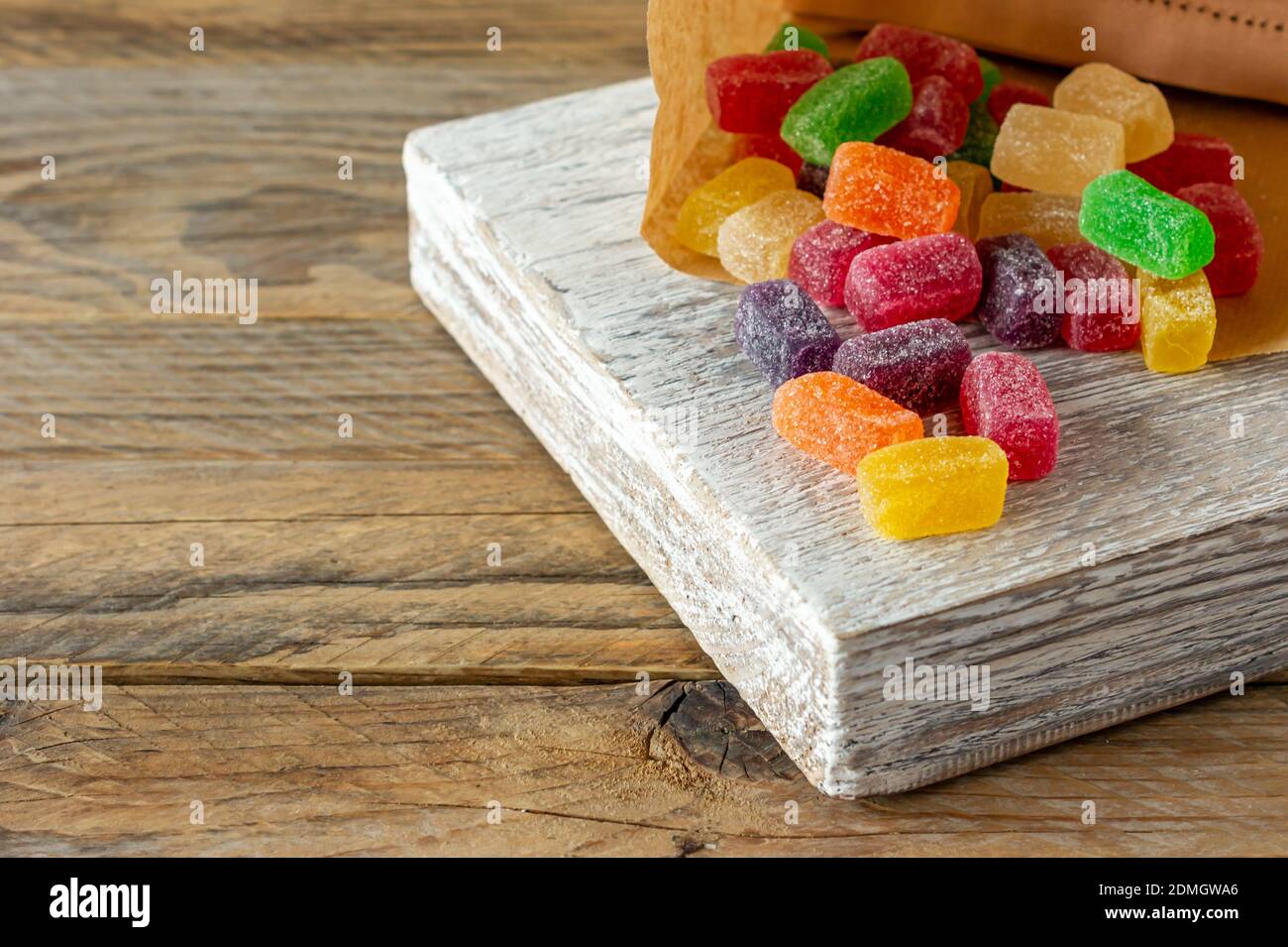 Assortment of chewing marmalade of different colors on wooden desk. Tasty  trats for kids. copy space Stock Photo - Alamy