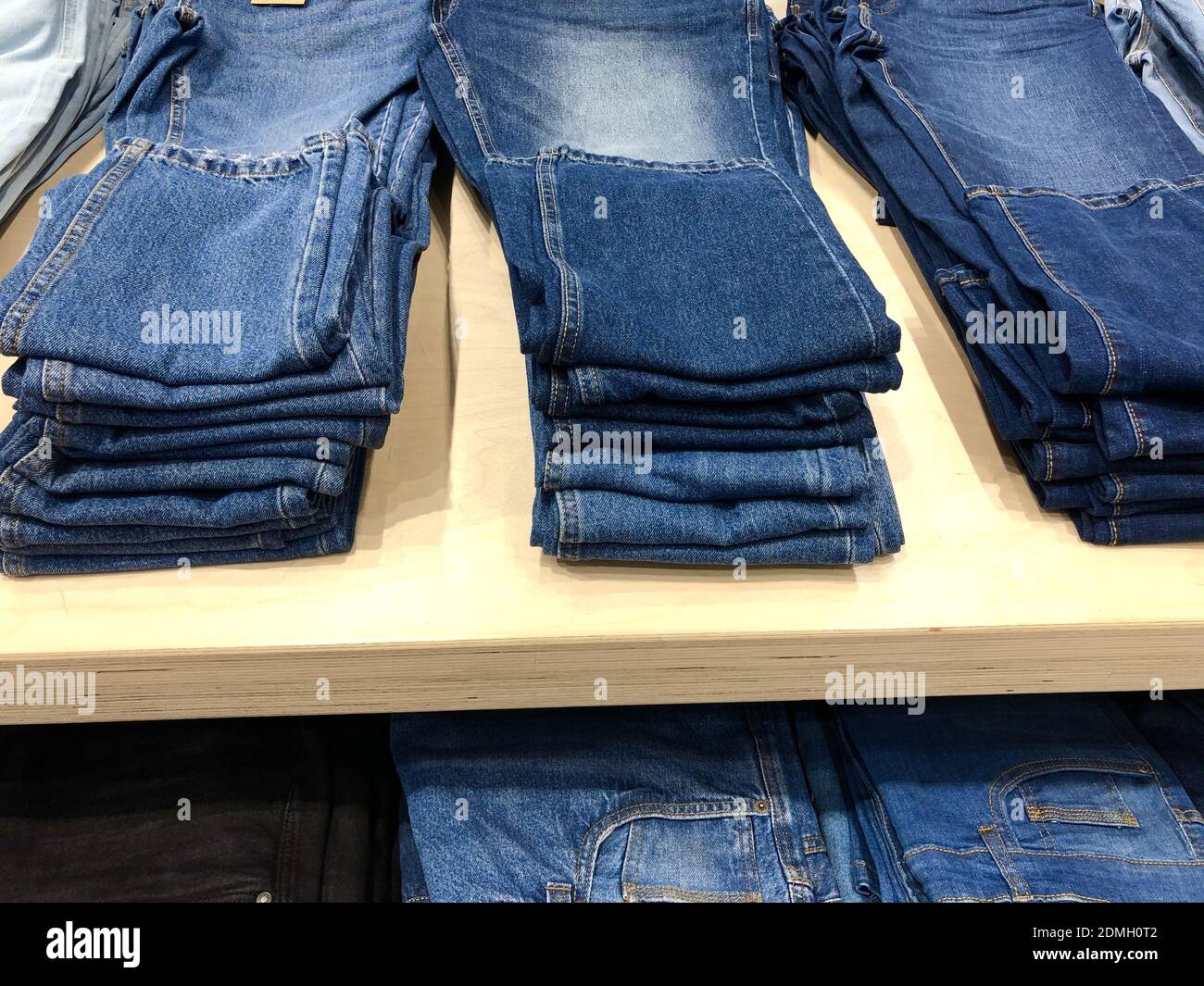 Blue jeans for men on sale in a store Stock Photo Alamy