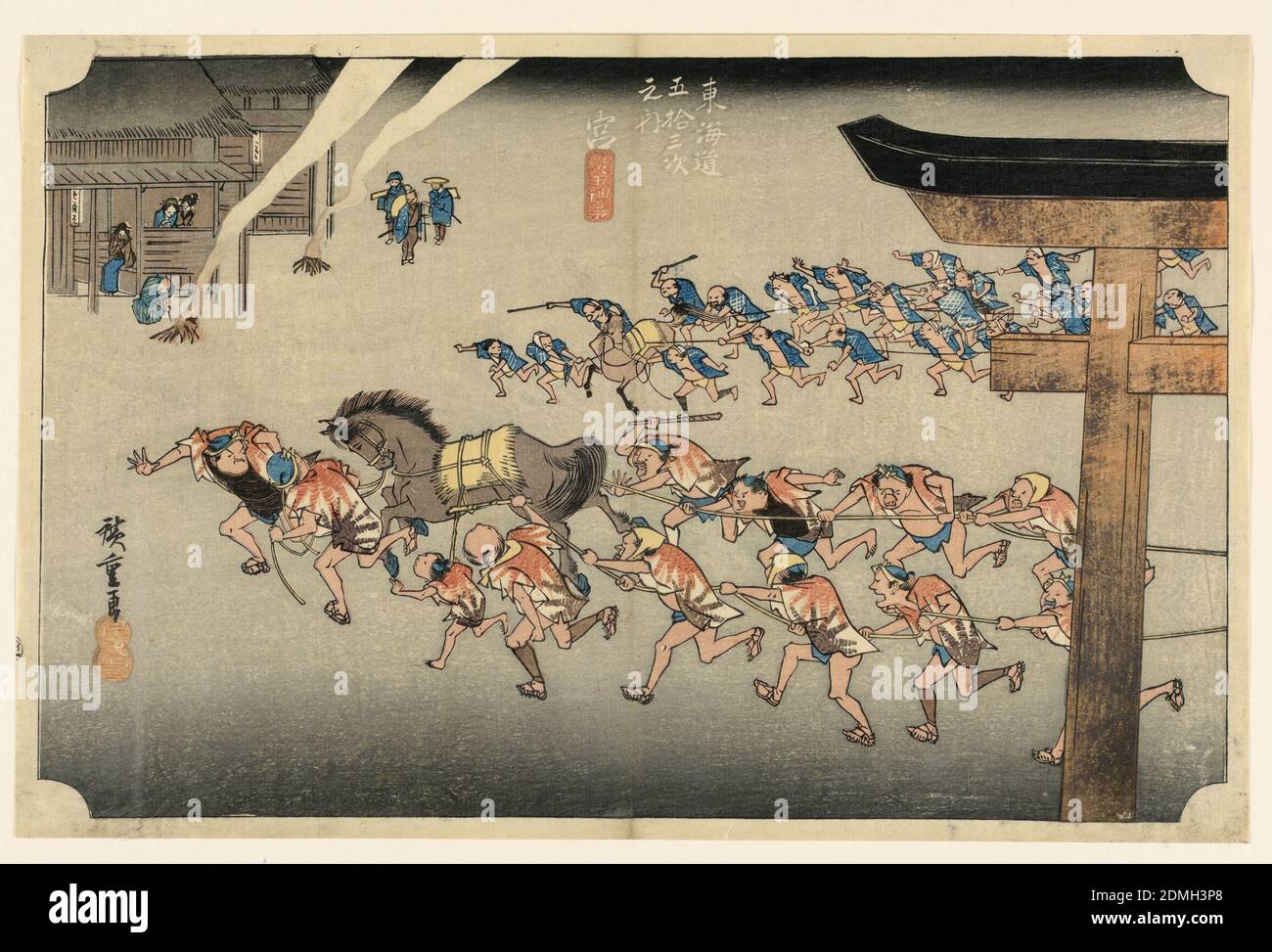Miya (Atsuta Jiuji Temple Fete), in The Fifty-Three Stations of the Tokaido Road (Tokaido Gojusan Tsugi-no Uchi), Ando Hiroshige, Japanese, 1797–1858, Woodblock print (ukiyo-e) on mulberry paper (washi), ink with color, Two teams of men, each with horse, hauling festival cars (not visible), from right to left. Right, part of Torii is seen. Left, building outside of which are two fires, and people watching activities., Japan, ca. 1834, figures, Print Stock Photo