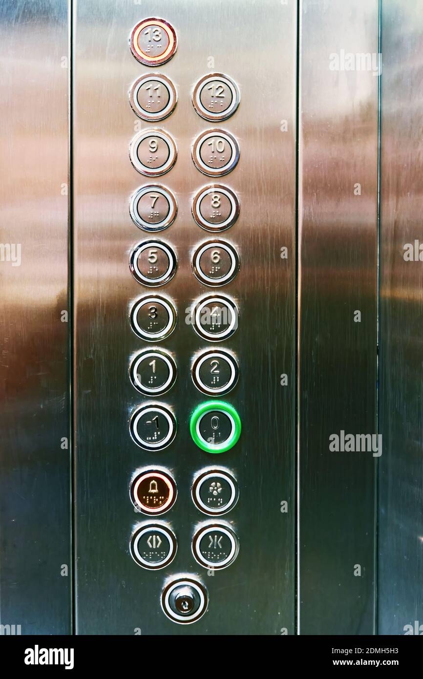 Elevator floor selection buttons on a brushed metal control pad Stock Photo