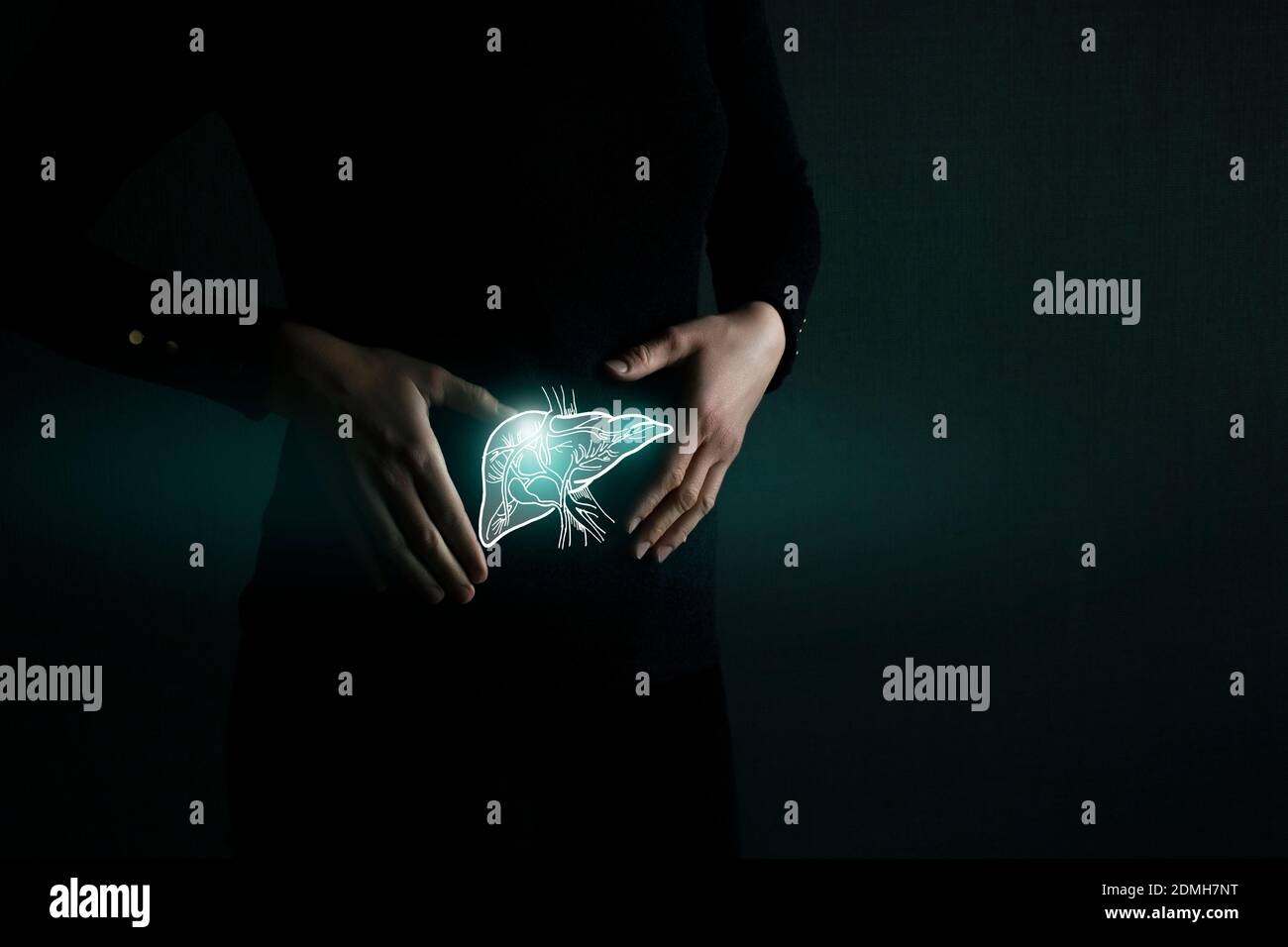 Illustration of liver detox with highlighted organ and contrast hands on dark background. Low key photo with copy space toned in dark green colors. Stock Photo