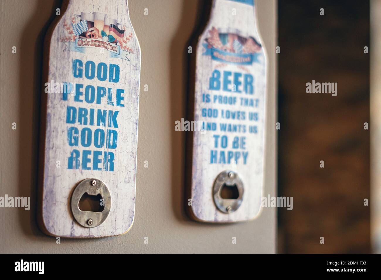 A closeup shot of bottle openers with funny beer quotes Stock