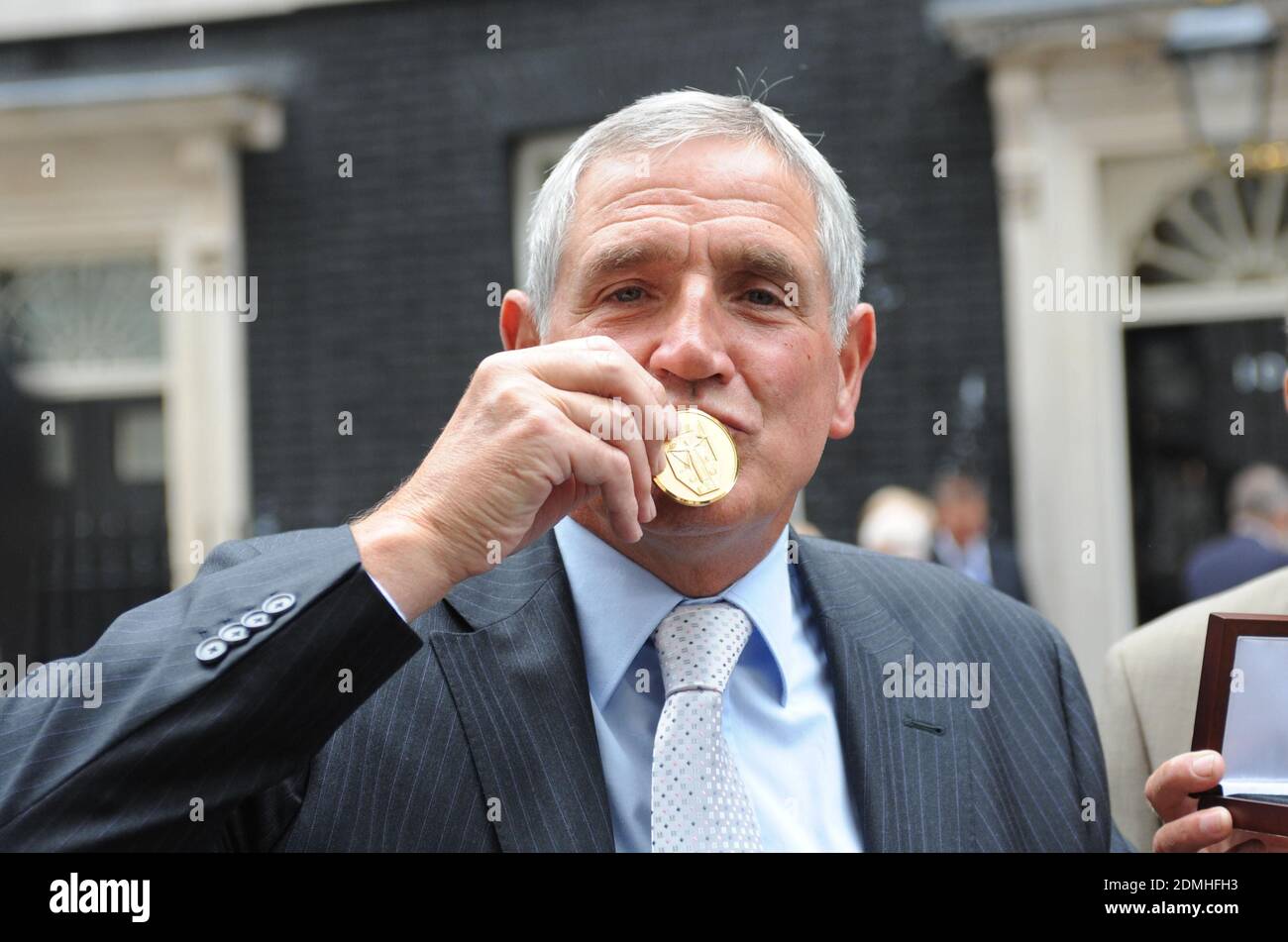 File photo dated 10-06-2009 of Norman Hunter kisses his medal. Stock Photo
