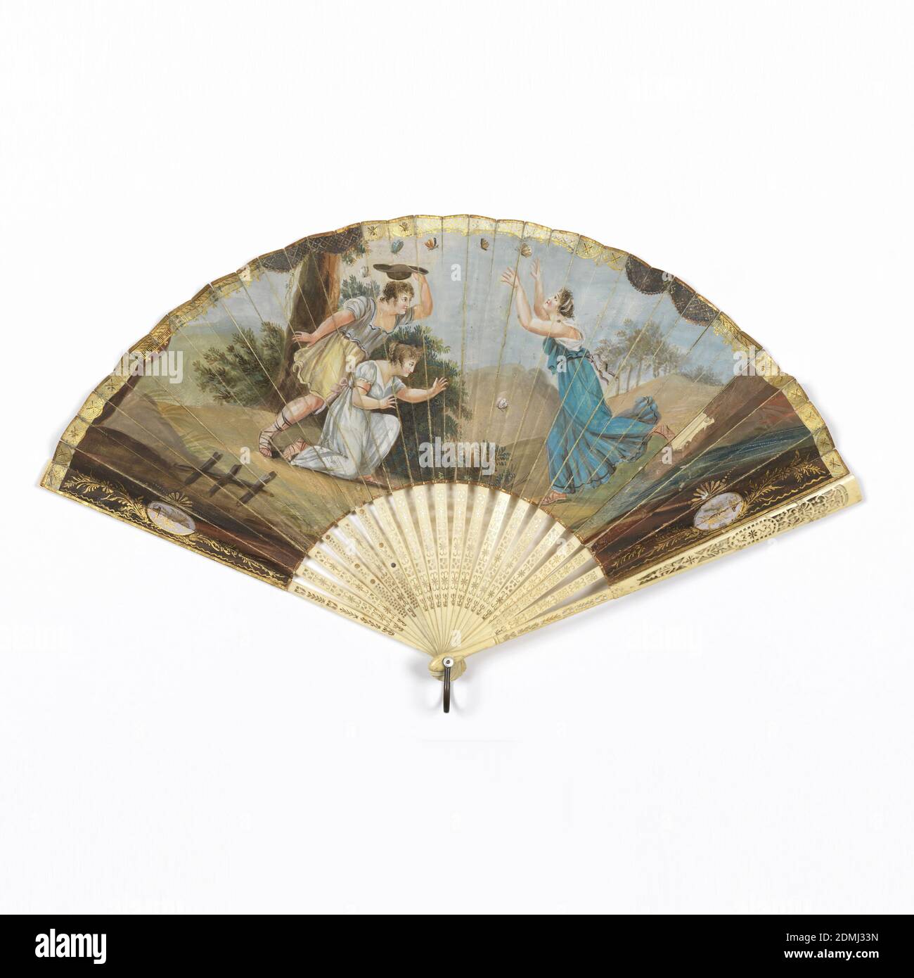Pleated fan, Gilded and hand-colored printed paper leaf, ivory sticks carved à jour, Pleated fan. Gilded and hand-colored paper leaf with print. Obverse: scene of two women and one man chasing butterflies. Reverse: plain. Unpainted ivory sticks carved à jour., possibly Italy, early 19th century, costume & accessories, Pleated fan Stock Photo