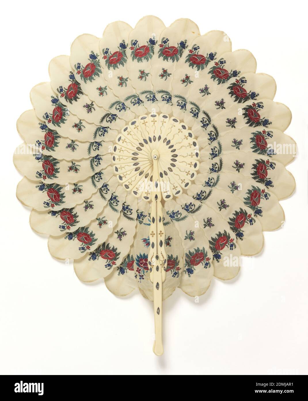 Cockade fan, Brocaded silk leaves, pierced bone handle and sticks, metal rivet with mother-of-pearl washer, Cockade fan with a pierced bone handle and slender sticks supporting twenty-four silk ovals, each with sixteen scallops, all edges rolled and whipped. Each leaf is decorated at three points with brocaded colored silk flowers, and attached to the guards by a slender stick on back. The two end ovals adhere to guards that have portions sliding in groove, forming handle. Inner ends of sticks pivot on a metal rivet with mother-of-[earl washer., possibly USA, possibly France, ca. 1850, costume Stock Photo