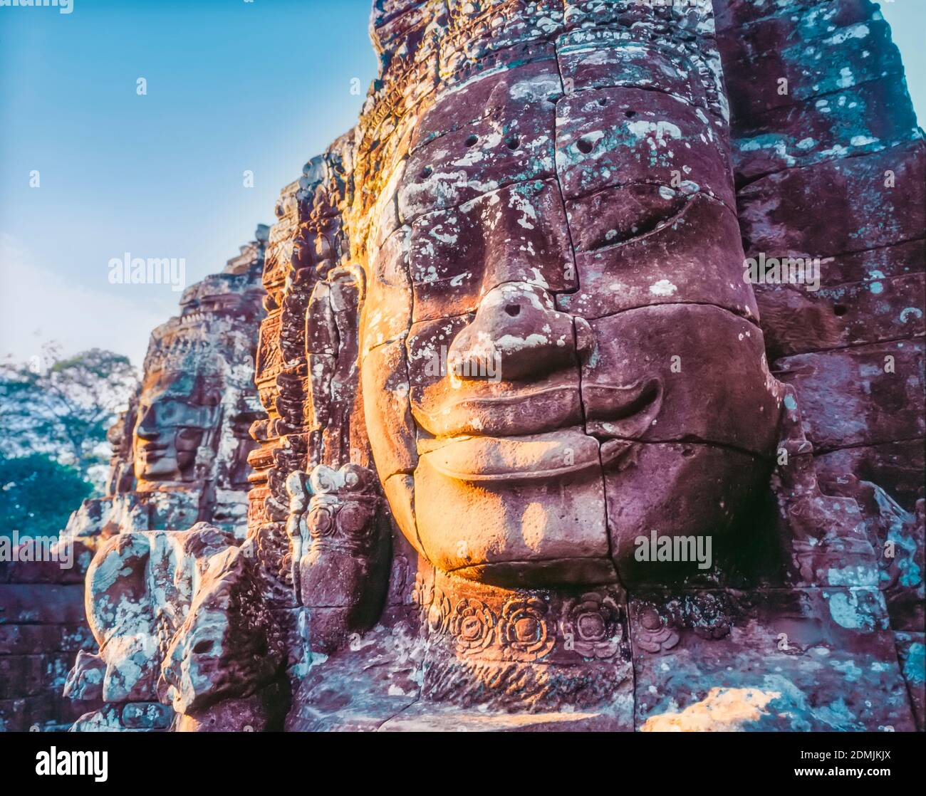 Stone face sculpture at Tonle Om Gate, or south entrance to Angkor Thom, Angkor Wat complex, Cambodia Stock Photo