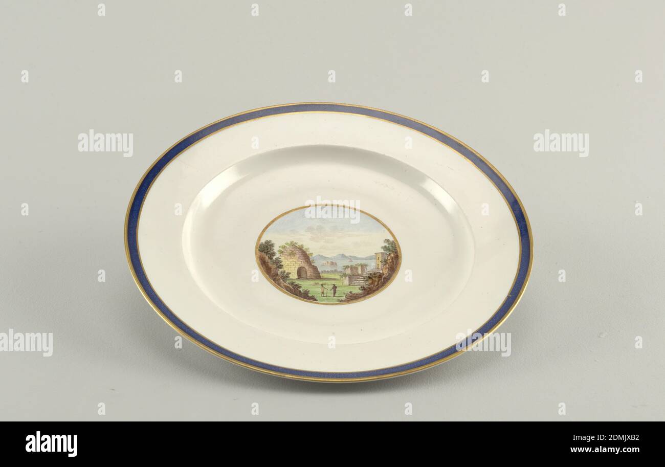 Plate, Doccia Porcelain Factory, Italian, established 1735, porcelain, vitreous enamel, gold, Plate with blue and gold border. At center of well, depiction of two figures in Roman ruins landscape with sea in background. On base: 'Tomba di Virgilio.' (Virgil's Tomb)., Doccia, Italy, ca. 1800–20, ceramics, Decorative Arts, plate, plate Stock Photo