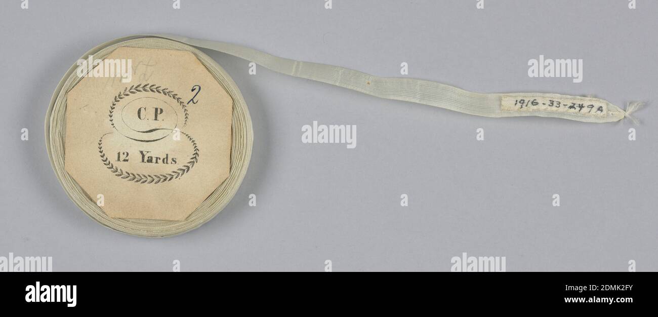 Tape, Medium: silk Technique: plain weave, White tape or seam binding on a flat wooden spool., USA, mid-19th century, woven textiles, Tape Stock Photo