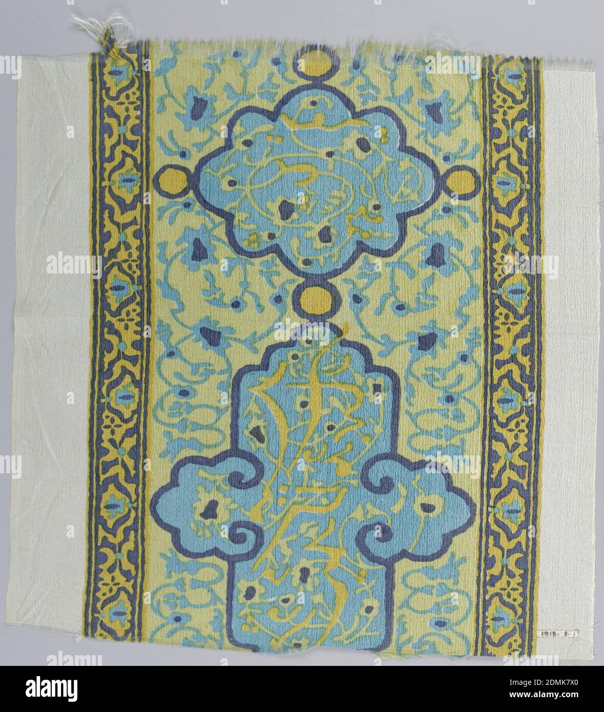 Fragment, Duplan Silk Corporation, (Hazleton, Pennsylvania, USA), Medium: silk Technique: printed by engraved roller on plain weave, Dress-weight silk fabric with a border design of floral and calligraphic motifs, in the style of Hispano-Arabic tile. Printed in dark blue, turquoise, and two yellows on an off-white ground., 1914–1918, printed, dyed & painted textiles, Fragment Stock Photo