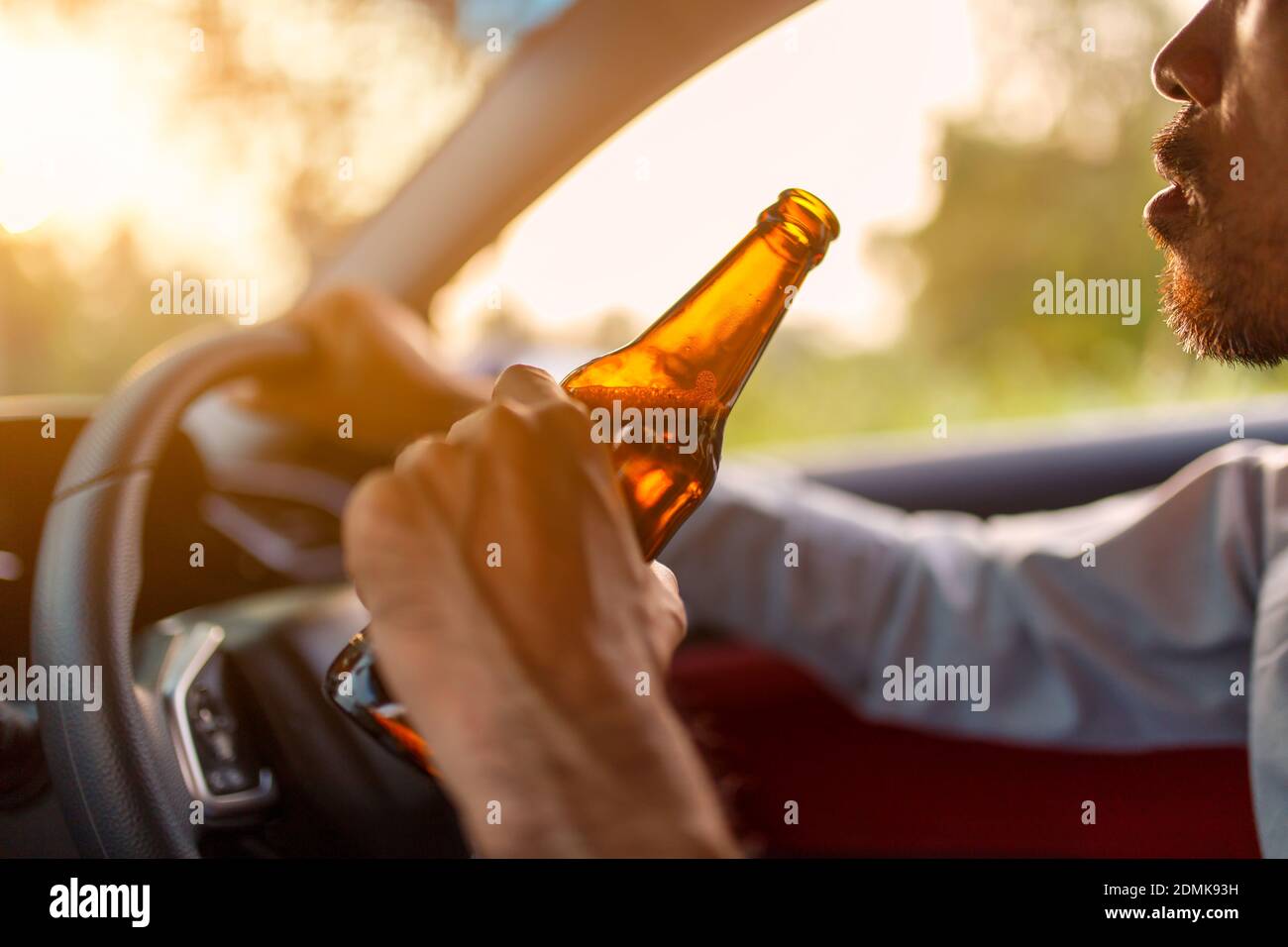 Hand Holding Beer Bottle Driving High Resolution Stock Photography and ...