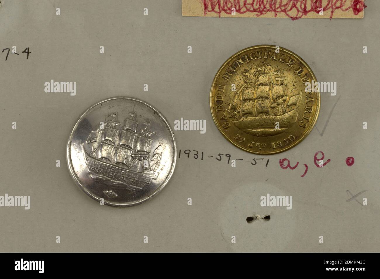 Button, Brass, pewter, Four buttons for special troop, guard of paris, 16 July 1830-1848. A, B) brass button ornamented with ship surrounded by the words 'Garde Municipale de Paris 29 Jet 1830'. C, D) Pewter buttons with ship similar to that on A and B but without legend., Component -b is on Cooper Union Exhibition card 5, Components -a,-c are on card J, France, 1830–48, costume & accessories, Decorative Arts, Button Stock Photo