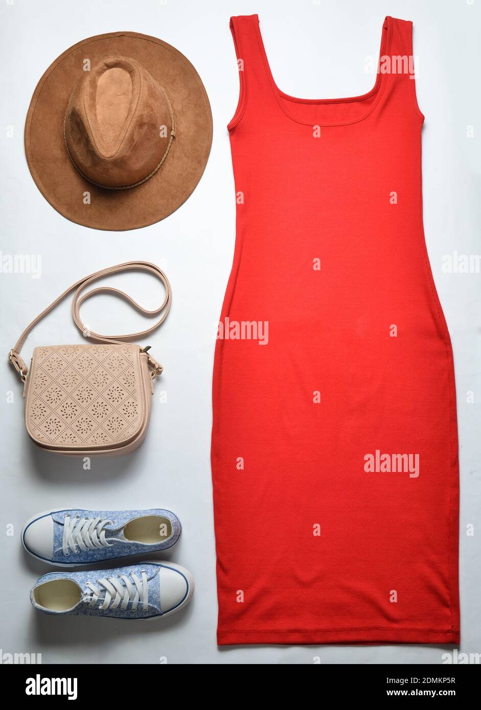 Women's accessories and clothing. Red dress, leather bag, sneakers