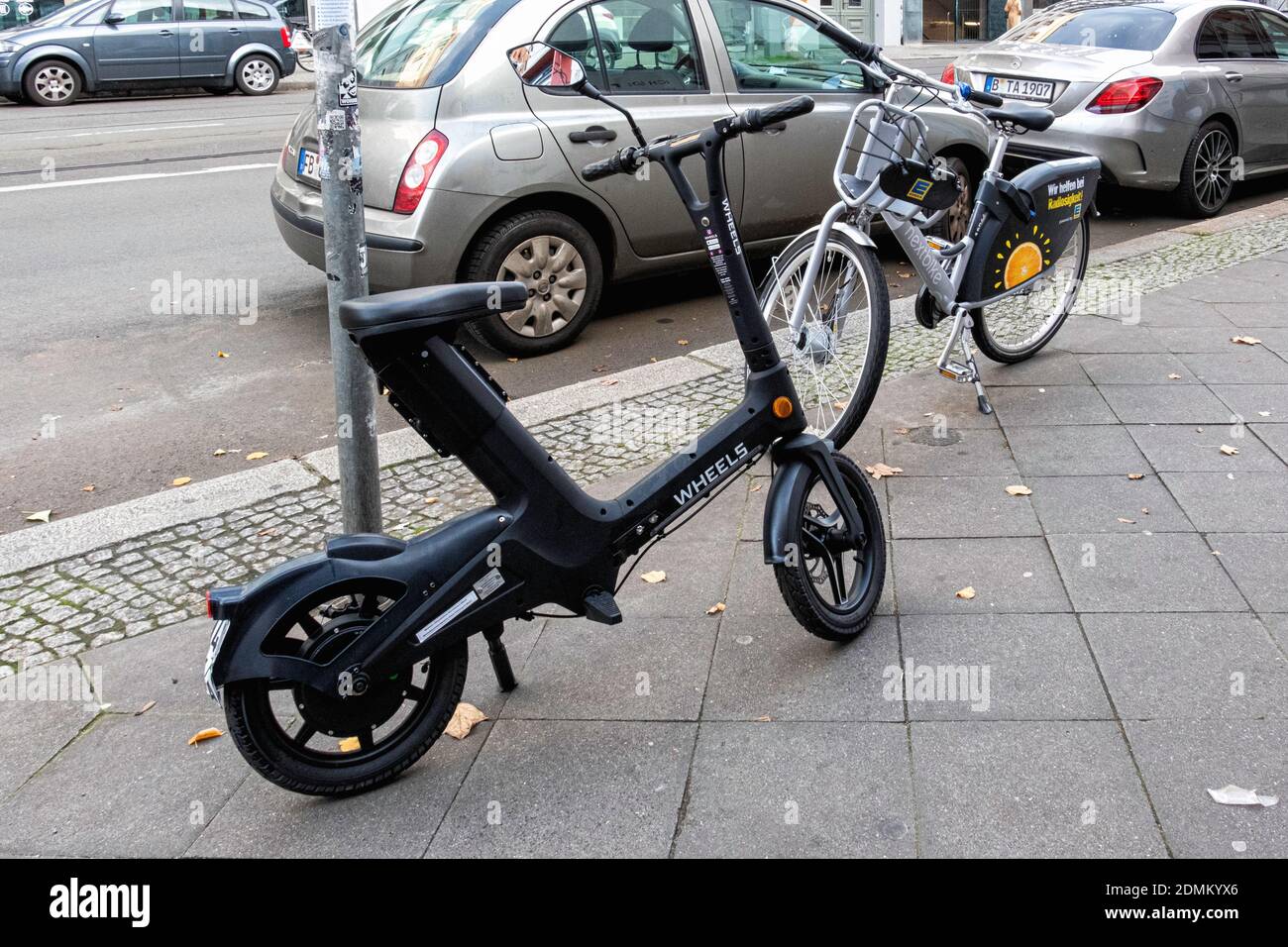 Wheels seated electric scooter hires stock photography and images Alamy