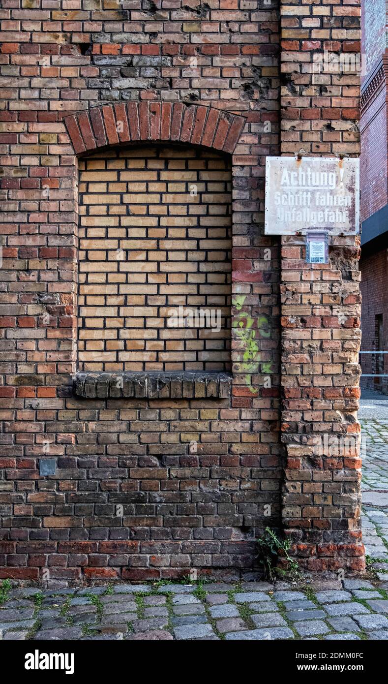 Former Pfefferberg Brewery. Historic Old Brick Building In Prenzlauer Berg, berlin. faded old Achtung sign Stock Photo