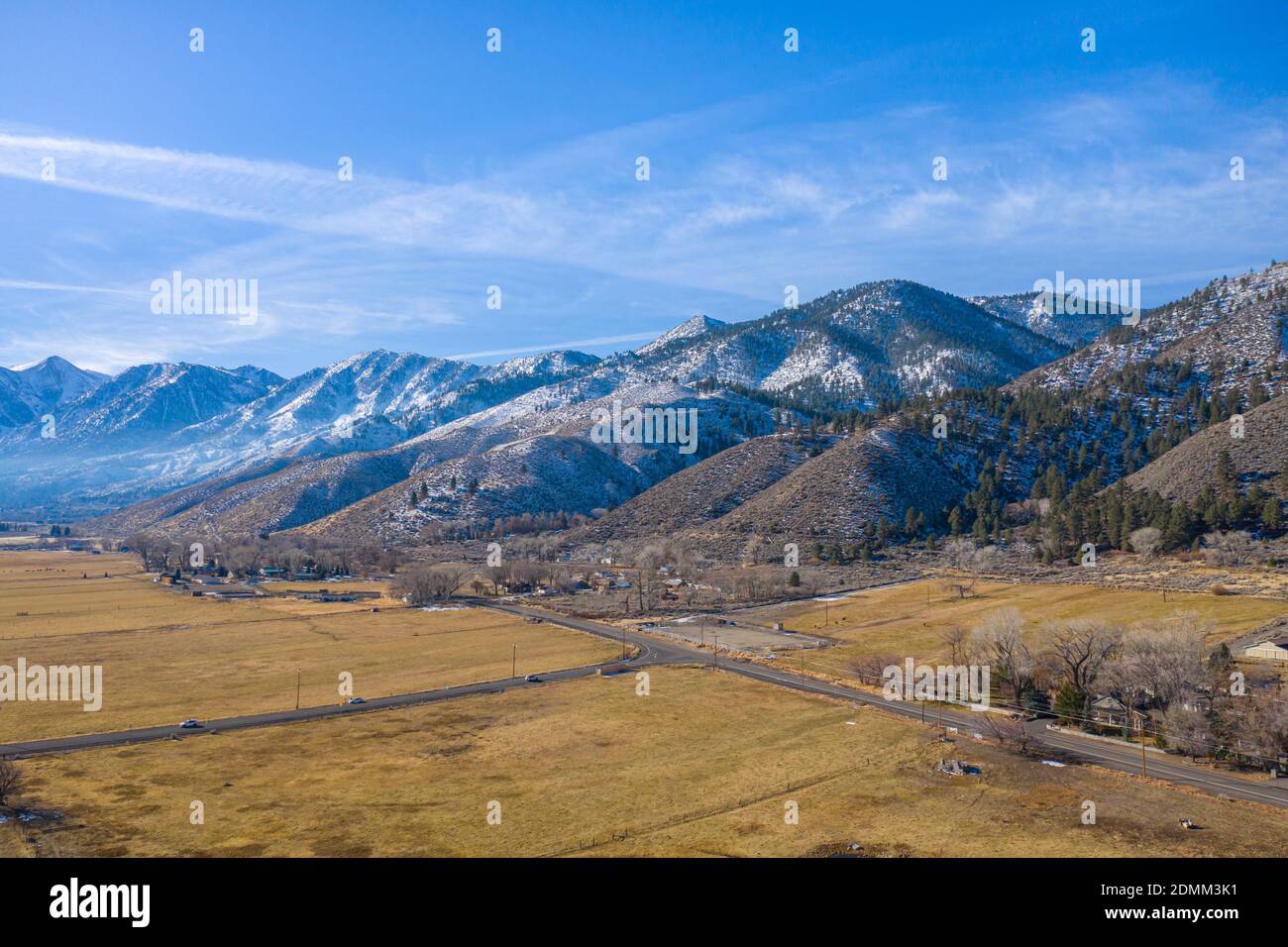 GENOA, NEVADA, UNITED STATES - Dec 15, 2020: A rural intersection in the town of Genoa, Nevada, beneath the snow-capped peaks of the Sierra Nevada mou Stock Photo