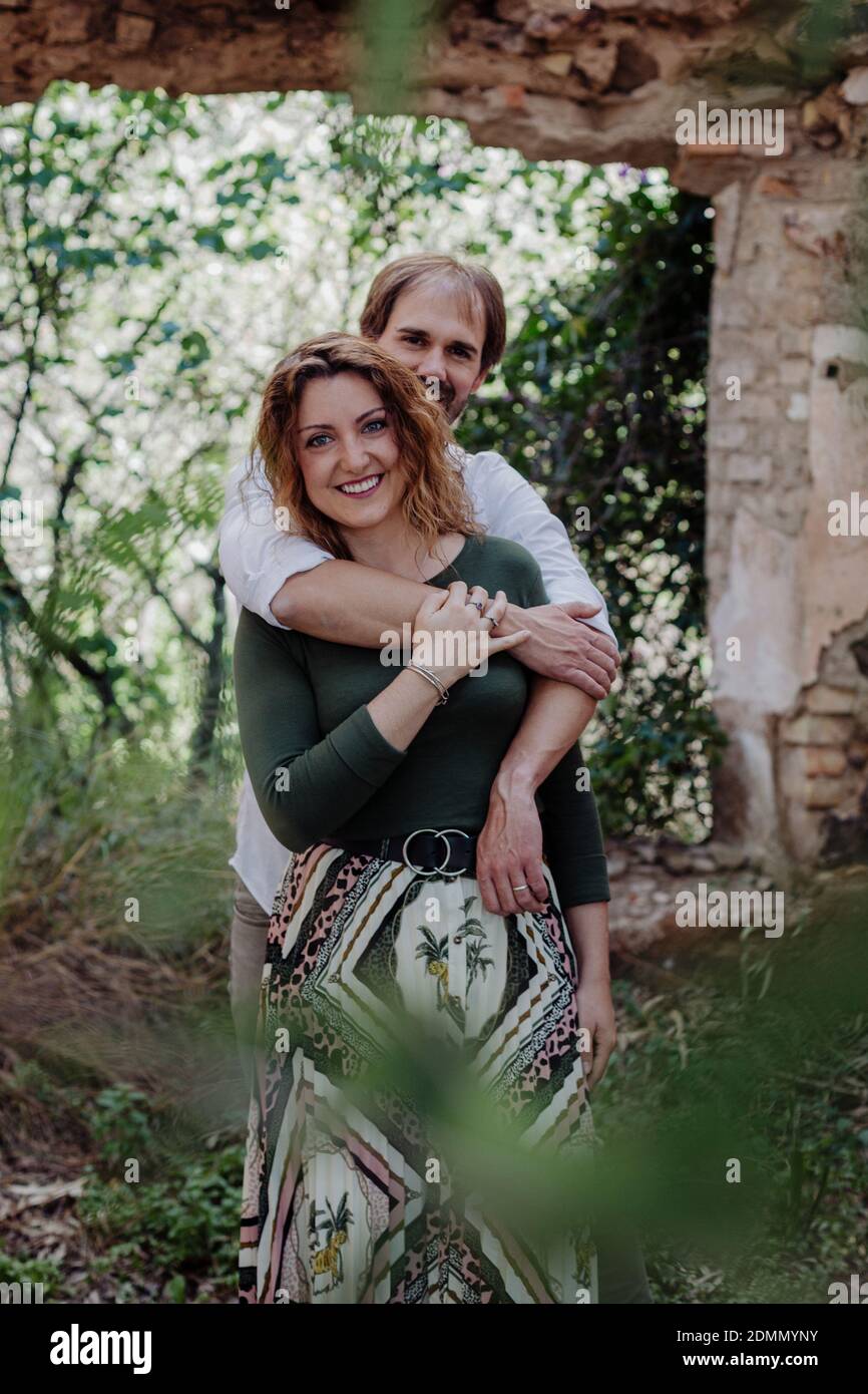 Engagement photo session of a young couple in the countryside. Family enjoying tender moment, happy marriage. family concept Stock Photo