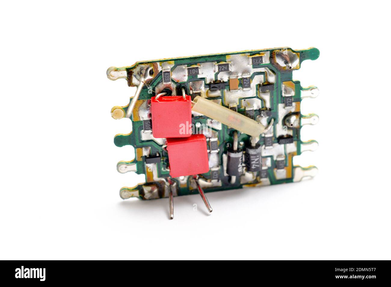 Cracked disassembled broken small vintage electronic device on white ...