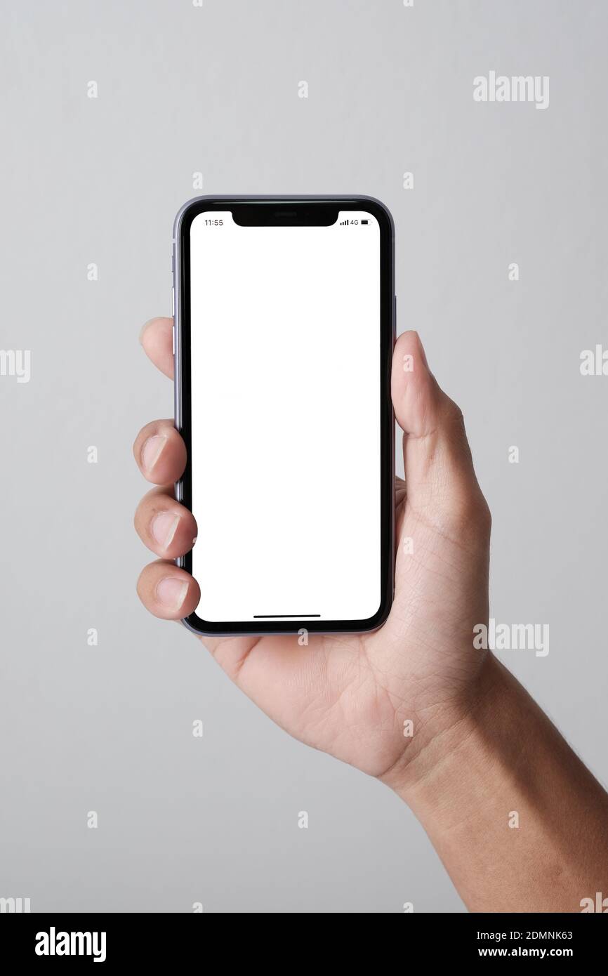 Studio Shot Of Hand Holding Smartphone Iphone 11 Pro Max And Show White Screen Stock Photo Alamy